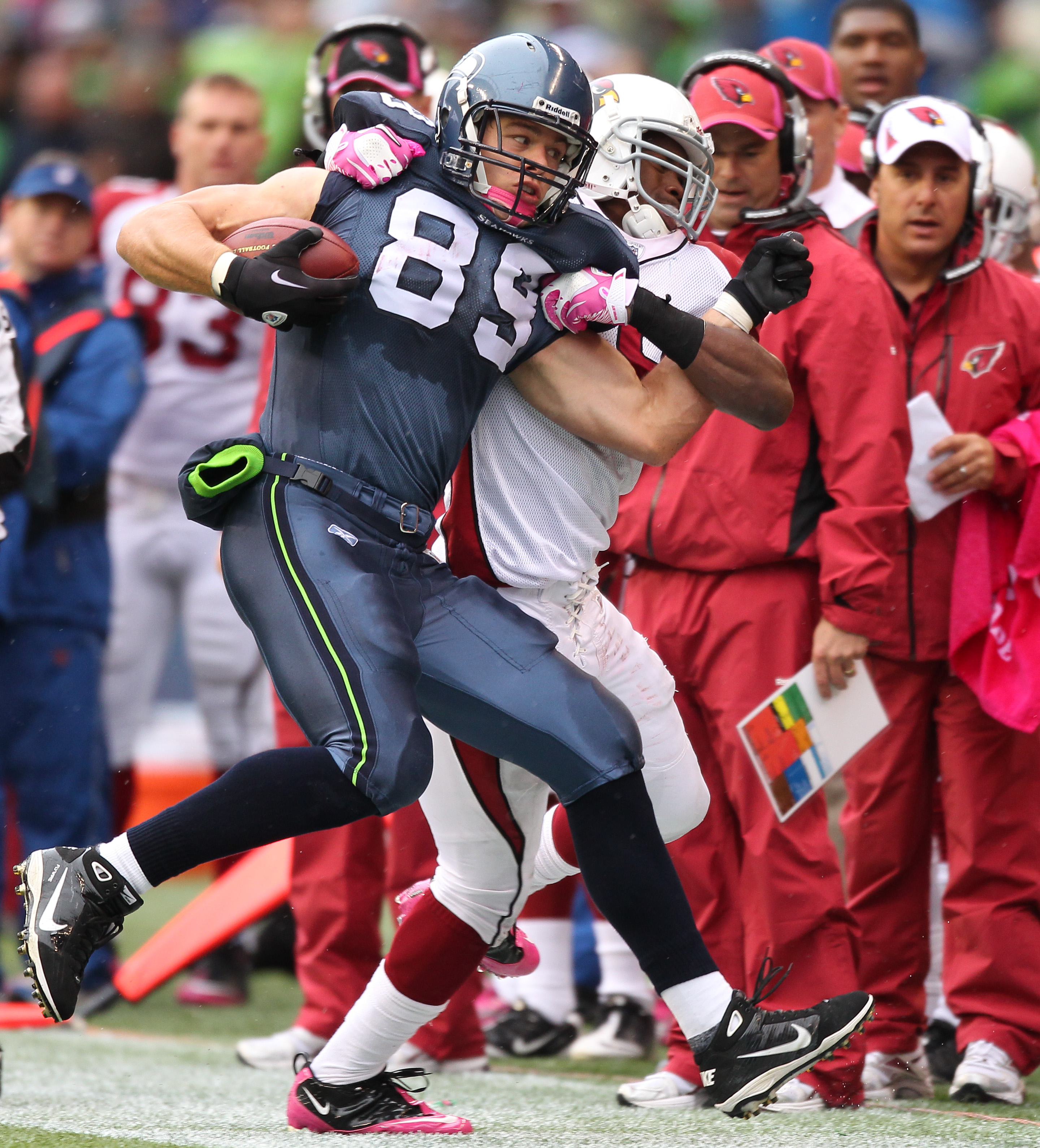 SEATTLE - OCTOBER 24:  Tight end John Carlson #89 of the Seattle Seahawks is driven out of bounds by linebacker Daryl Washington #58 of the Arizona Cardinals at Qwest Field on October 24, 2010 in Seattle, Washington. (Photo by Otto Greule Jr/Getty Images)
