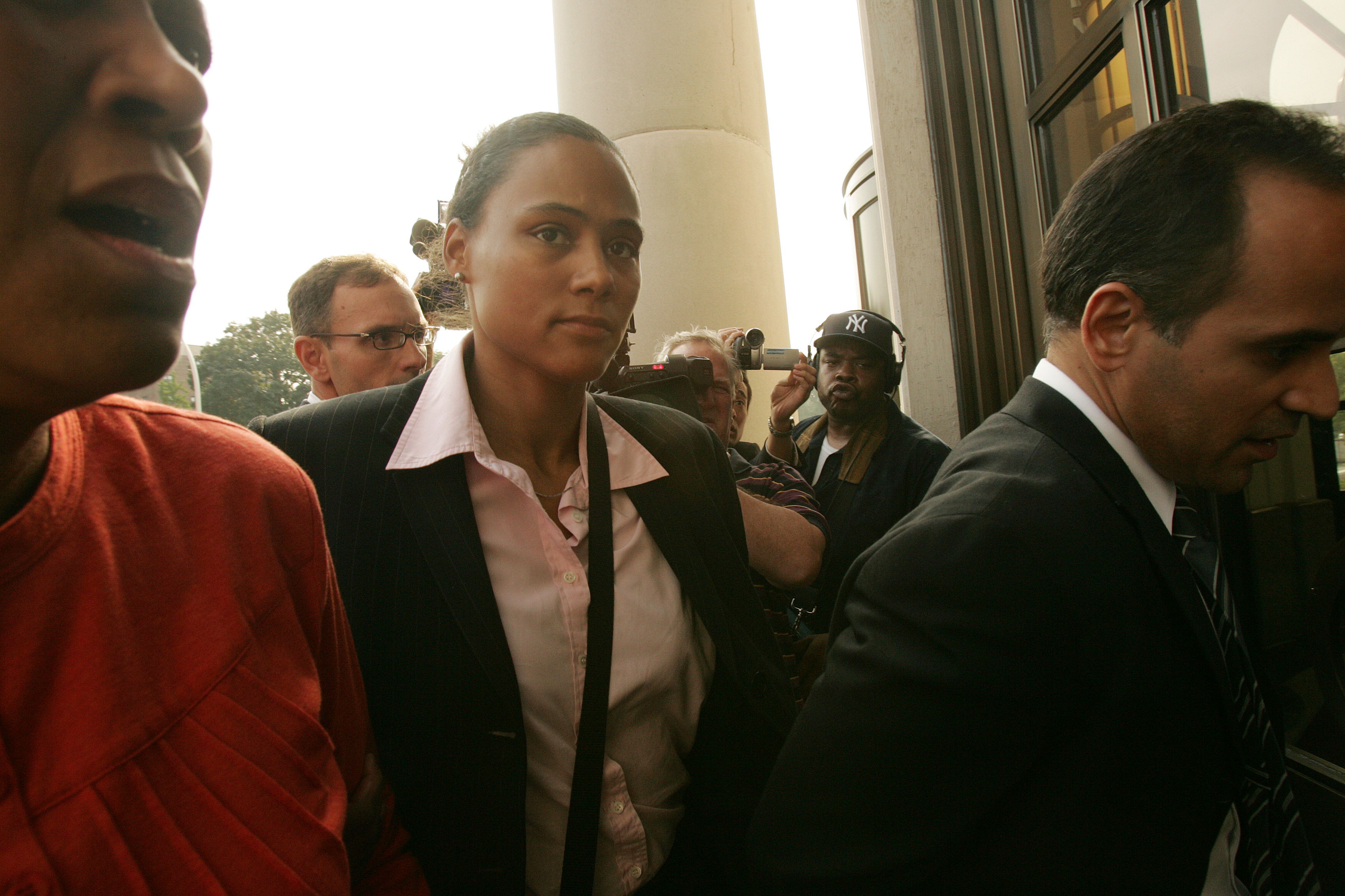 WHITE PLAINS, NY - OCTOBER 5:  Three-time Olympic gold medalist Marion Jones (C) enters a United States federal courthouse October 5, 2007 in White Plains, New York. Jones is expected to plead guilty to charges in connection with steroid use.  (Photo by H