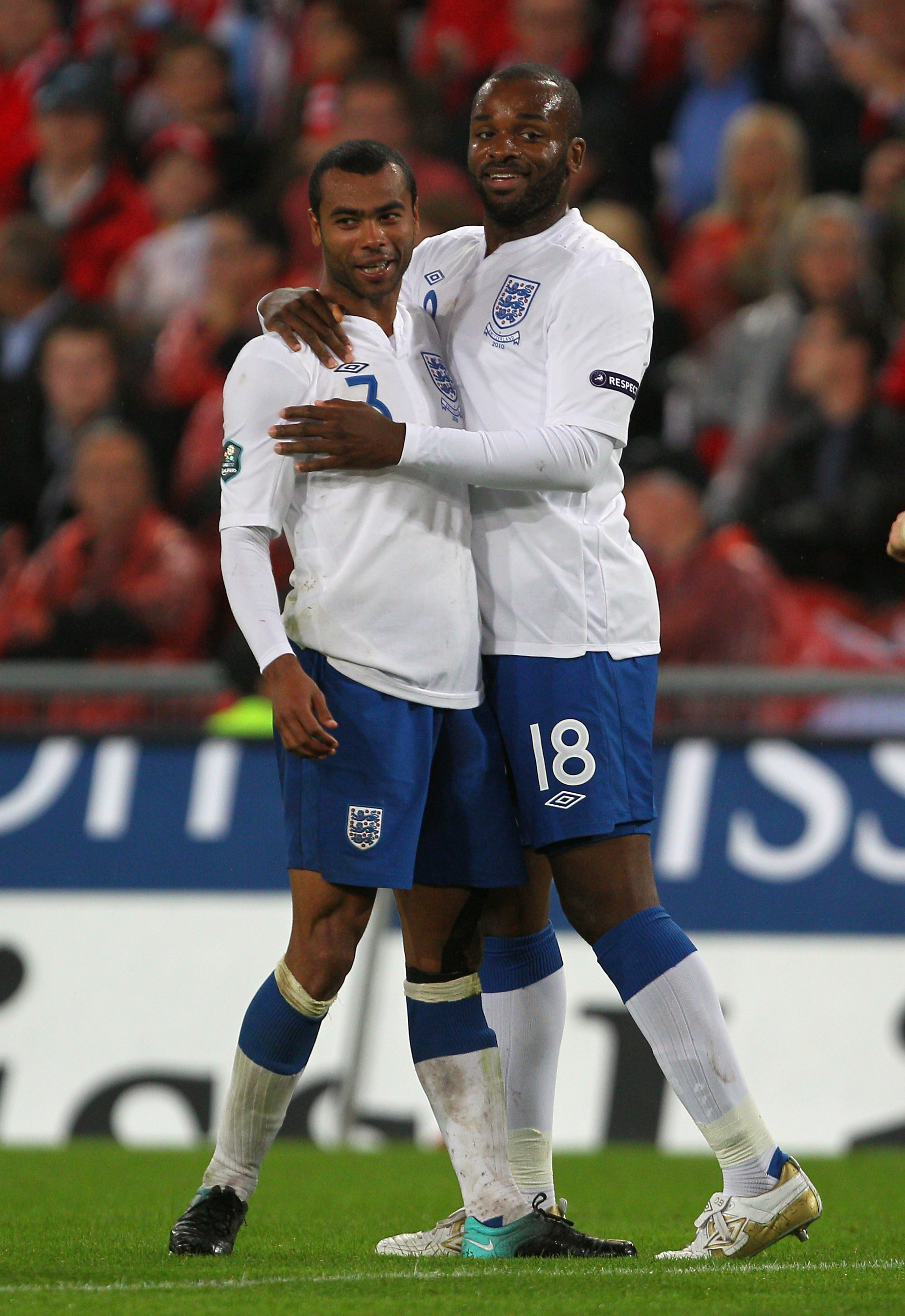 BASEL, SWITZERLAND - SEPTEMBER 07:  Darren Bent of England celebrates scoring his team's thrid goal with Ashley Cole during the EURO 2012 Group G Qualifier between Switzerland and England at St Jakob Park on September 7, 2010 in Basel, Switzerland.  (Phot