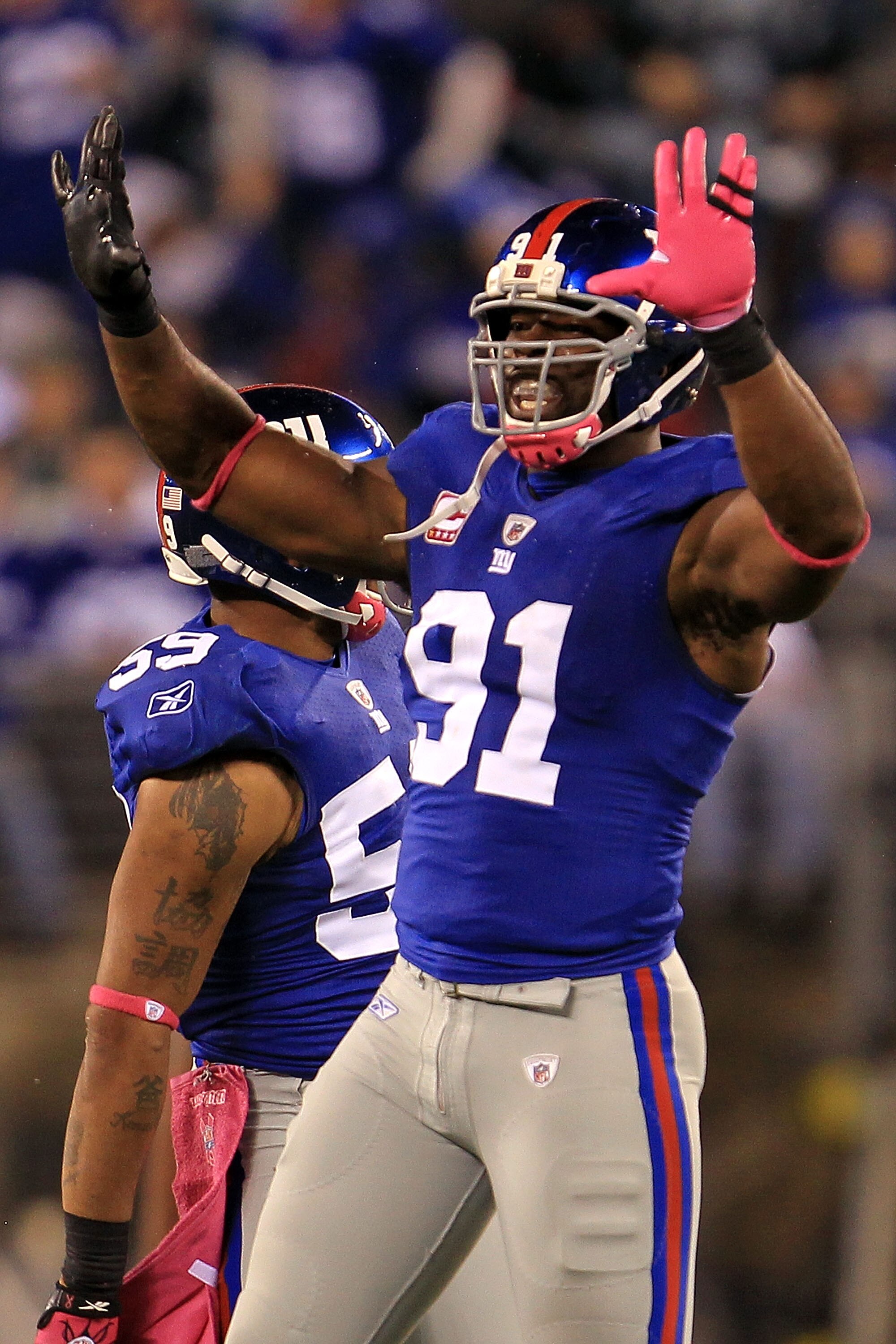 EAST RUTHERFORD, NJ - OCTOBER 03:  Justin Tuck #91 of the New York Giants celebrates after the tenth sack of the game against the Chicago Bear at New Meadowlands Stadium on October 3, 2010 in East Rutherford, New Jersey.  (Photo by Chris McGrath/Getty Ima