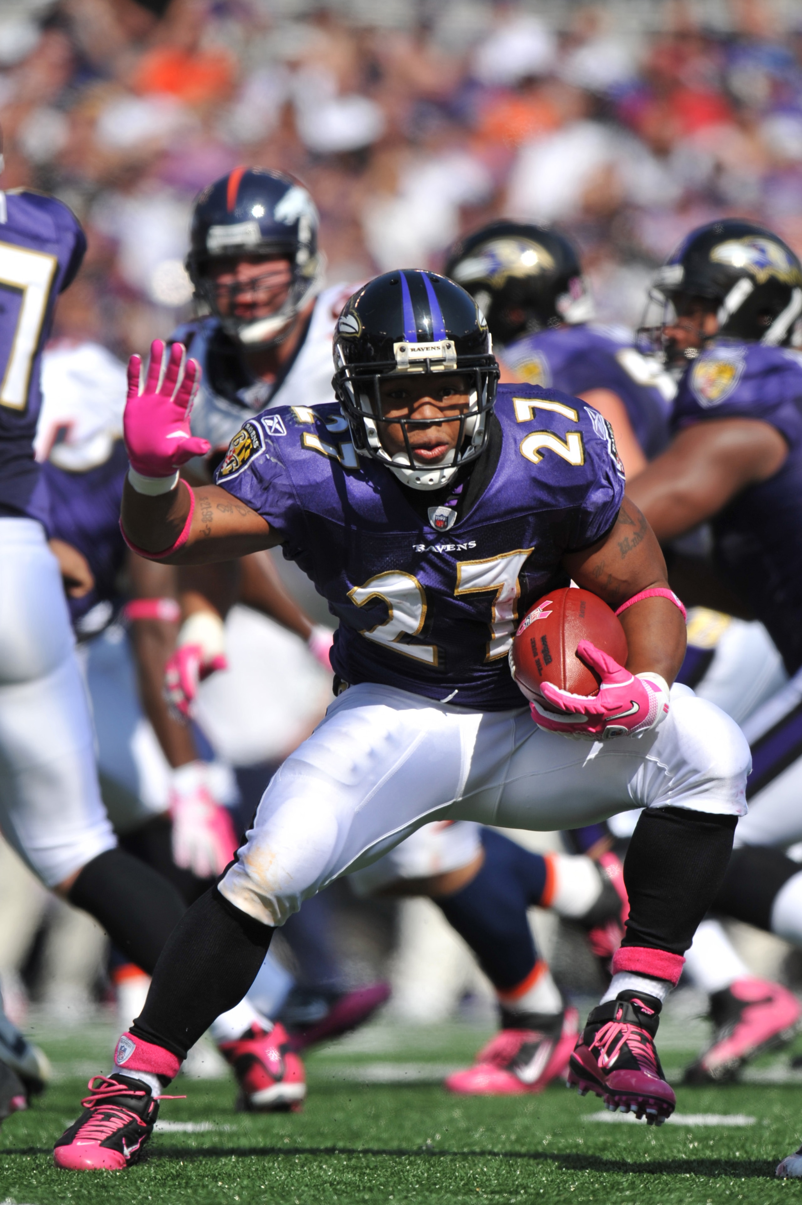 BALTIMORE, MD - OCTOBER 10: Ray Rice #27 of the Baltimore Ravens runs the ball against the Denver Broncos at M&T Bank Stadium on October 10, 2010 in Baltimore, Maryland. Players wore pink in recognition of Breast Cancer Awareness Month. The Ravens defeate BALTIMORE, MD - OCTOBER 10: Ray Rice #27 of the Baltimore Ravens runs the ball against the Denver Broncos at M&T Bank Stadium on October 10, 2010 in Baltimore, Maryland. Players wore pink in recognition of Breast Cancer Awareness Month. The Ravens defeate
