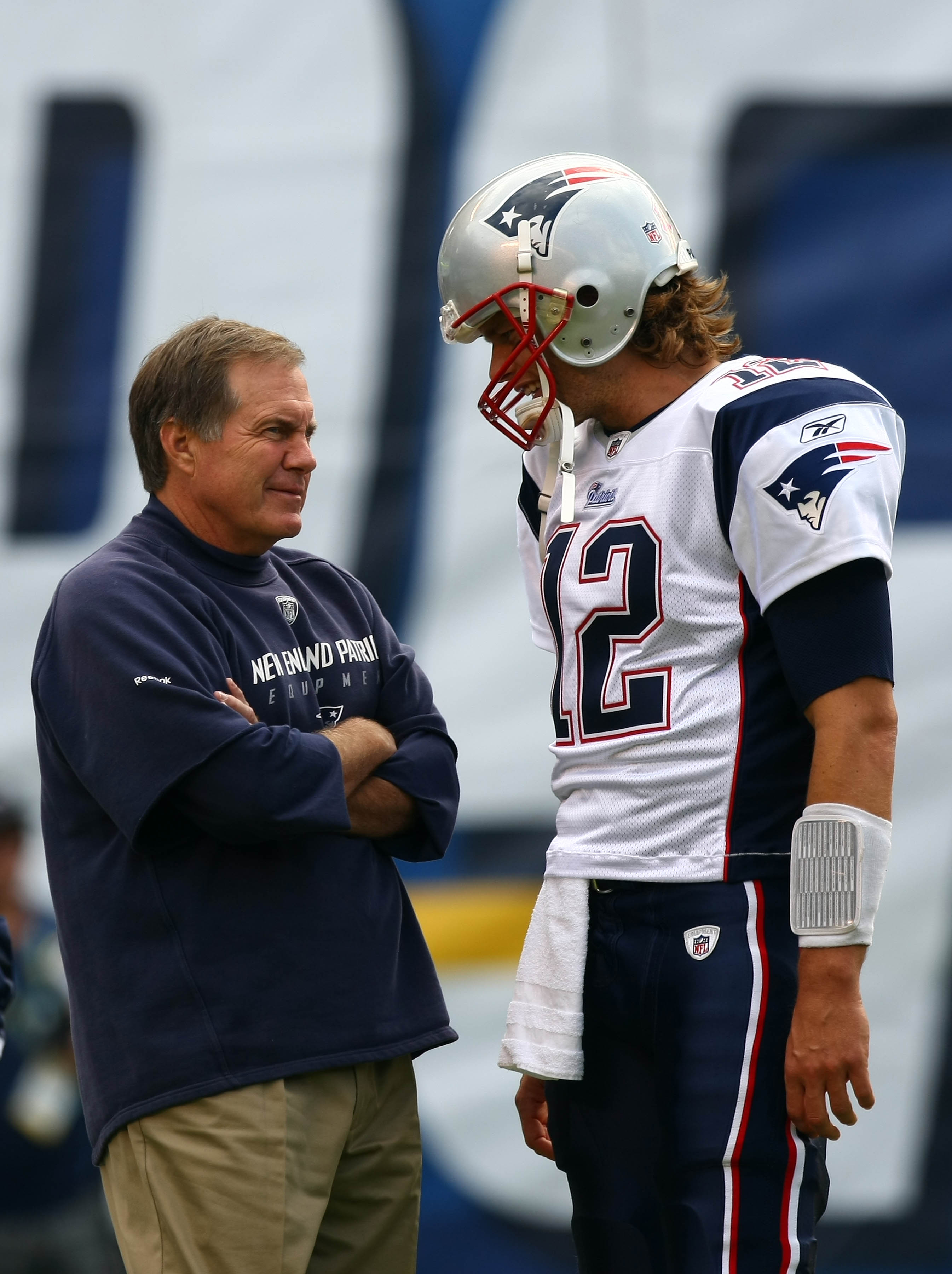 SAN DIEGO - OCTOBER 24:  Quarterback Tom Brady #12 of the New England speak to Head Coach Bill Belichick against the San Diego Chargers during their NFL game on October 24, 2010 at Qualcomm Stadium in San Diego, California. (Photo by Donald Miralle/Getty