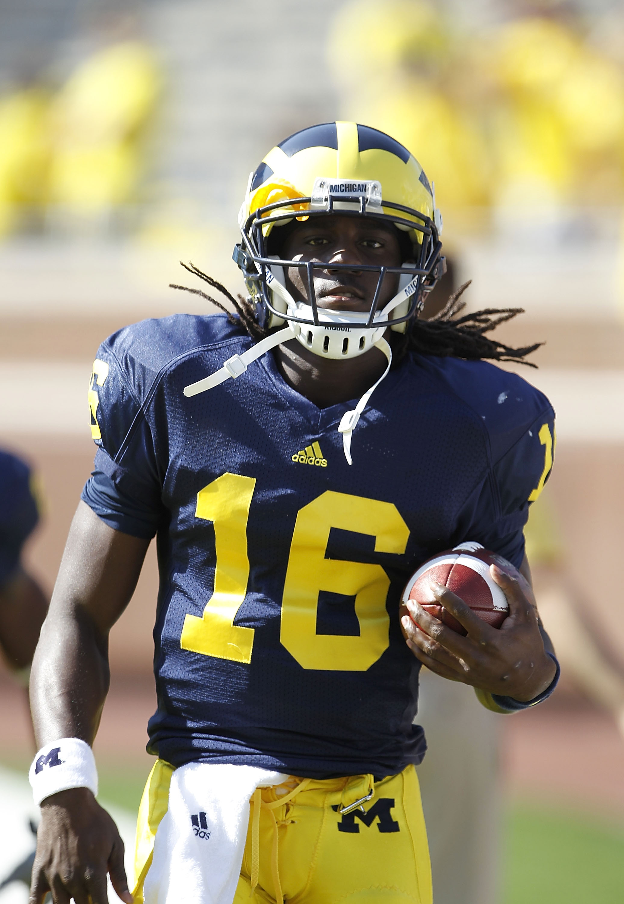 ANN ARBOR, MI - OCTOBER 09: Denard Robinson #16 of the Michigan Wolverines warms up prior to the start of the game against the Michigan State Spartans on October 9, 2010 at Michigan Stadium in Ann Arbor, Michigan. The Michigan State Spartans defeated the
