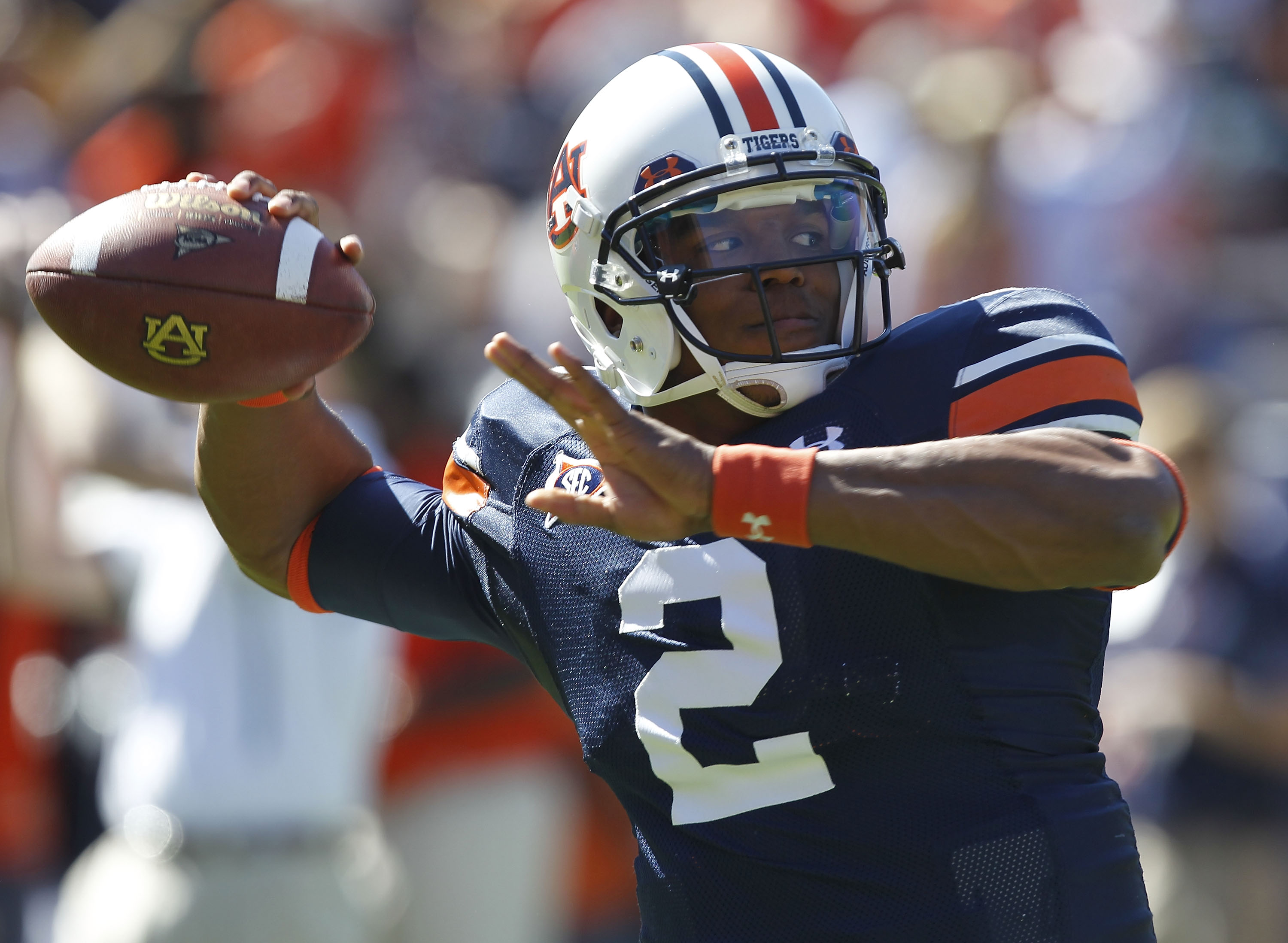 AUBURN, AL - OCTOBER 16:  Quarterback Cam Newton #2 of the Auburn Tigers throws a practice pass before the game against the Arkansas Razorbacks at Jordan-Hare Stadium on October 16, 2010 in Auburn, Alabama.  (Photo by Mike Zarrilli/Getty Images)