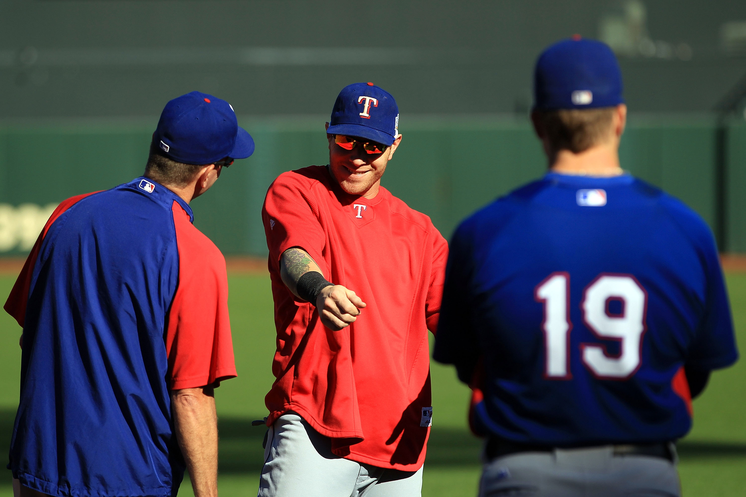 Texas Rangers hitting coach Rudy Jaramillo tips his hat to the