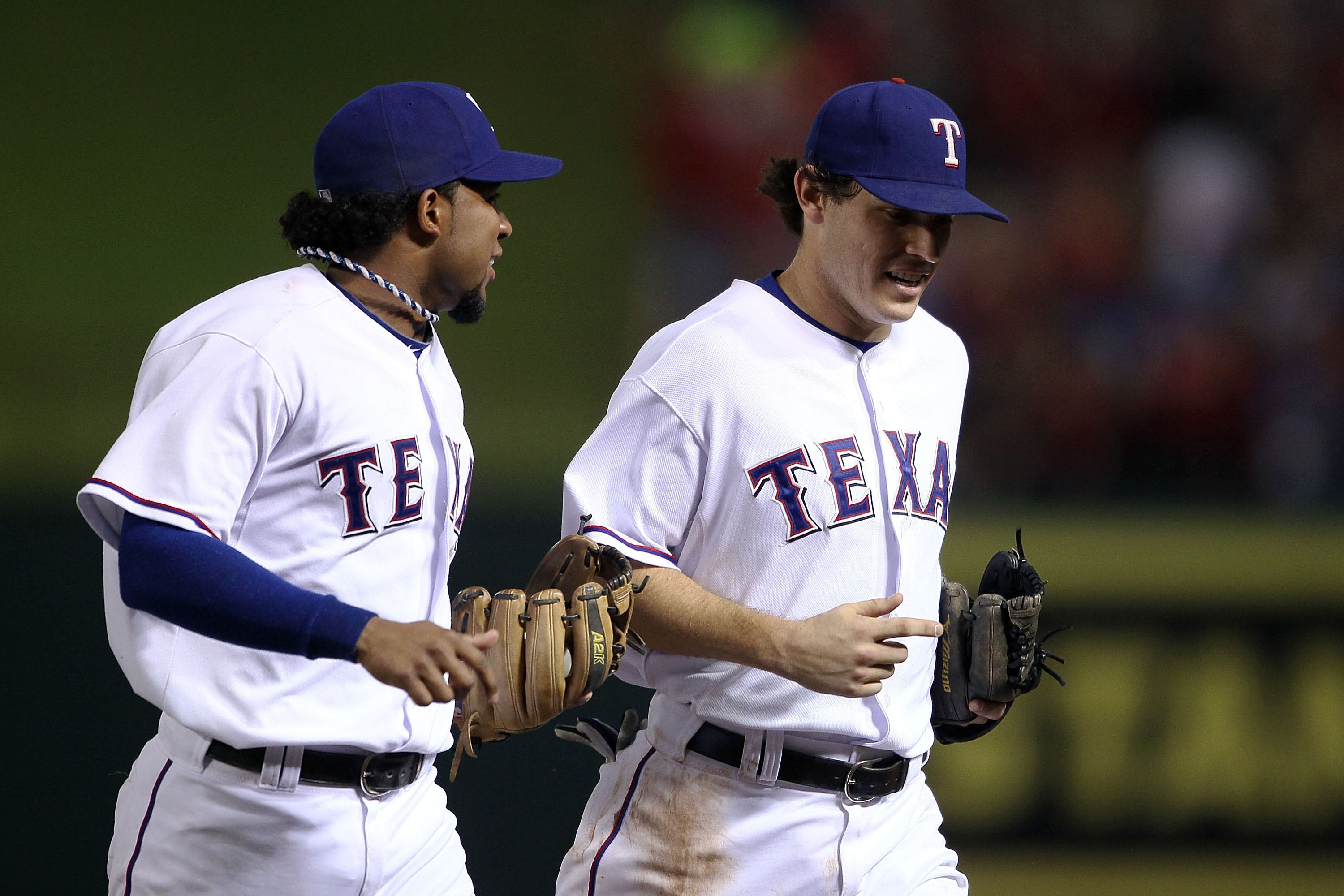 Texas Rangers Michael Young, right, is congratulated by teammate Josh  Hamilton after Young scored on a hit by Vladimir Guerrero in the third  inning against the Minnesota Twins during their baseball game