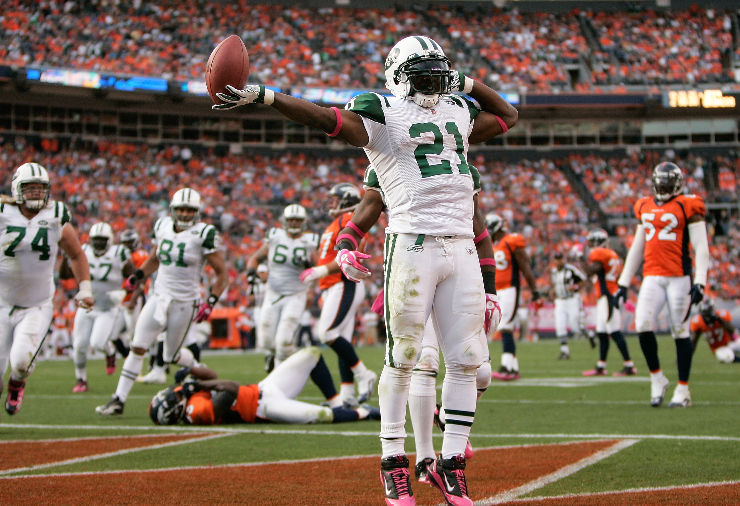 DENVER - OCTOBER 17:  Running back LaDainian Tomlinson #21 of the New York Jets celebrates his touchdown against the Denver Broncos at INVESCO Field at Mile High on October 17, 2010 in Denver, Colorado.  (Photo by Justin Edmonds/Getty Images)