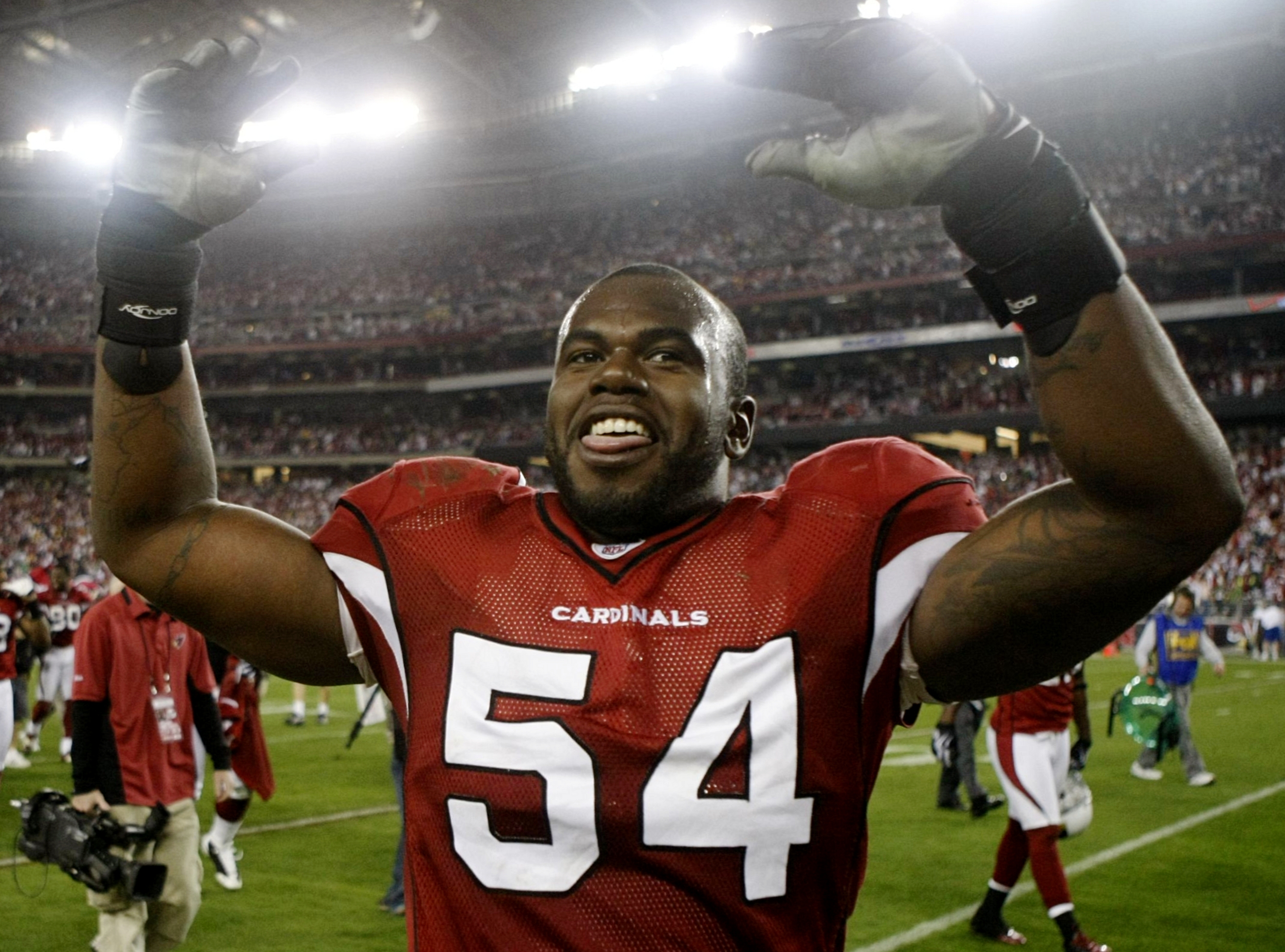 GLENDALE, AZ - JANUARY 10:  Linebacker Gerald Hayes #54 of the Arizona Cardinals walks off the field after defeating the Green Bay Packers 51-45 in the 2010 NFC wild-card playoff game at University of Phoenix Stadium on January 10, 2010 in Glendale, Arizo