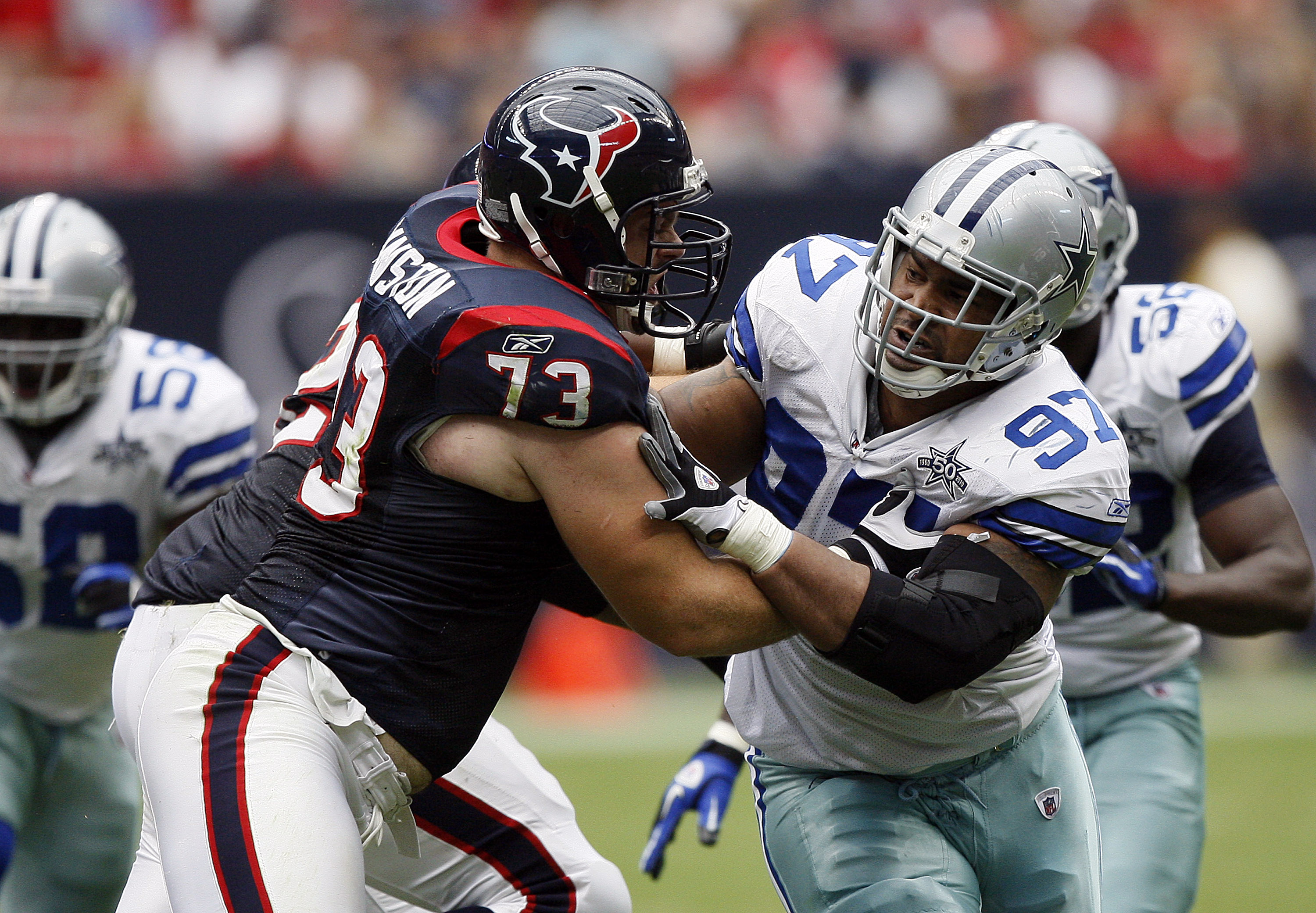 HOUSTON - SEPTEMBER 26:  Tackle Eric Winston #73 of the Houston Texans locks up with defensive end Jason Hatcher #97 of the Dallas Cowboys during the fourth quarter at Reliant Stadium on September 26, 2010 in Houston, Texas.  (Photo by Bob Levey/Getty Ima