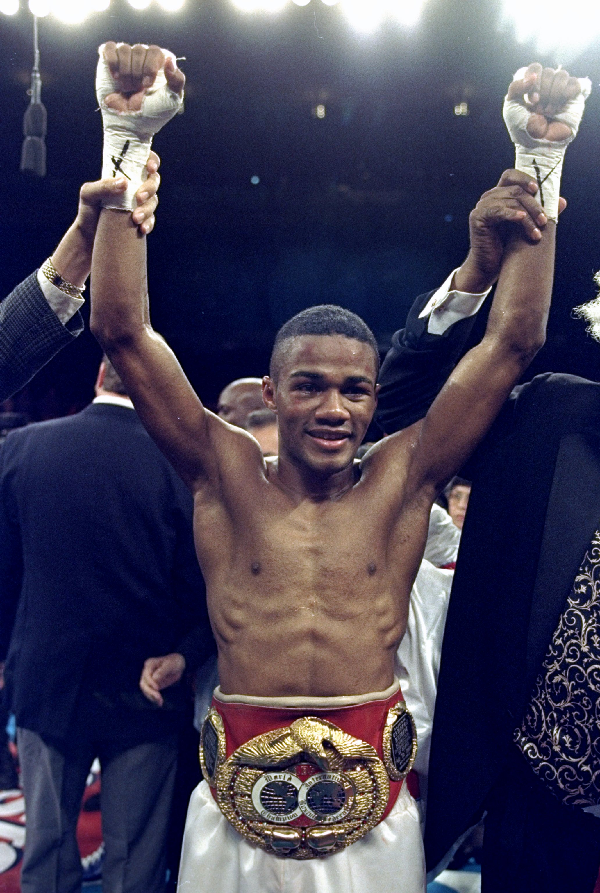 20 Feb 1999:  Felix Trinidad celebrates as he wears the belt after the fight against Pernell Whitaker at Madison Square Garden in New York, New York. Trinidad won by a decision in the 12th round. Mandatory Credit: Al Bello  /Allsport