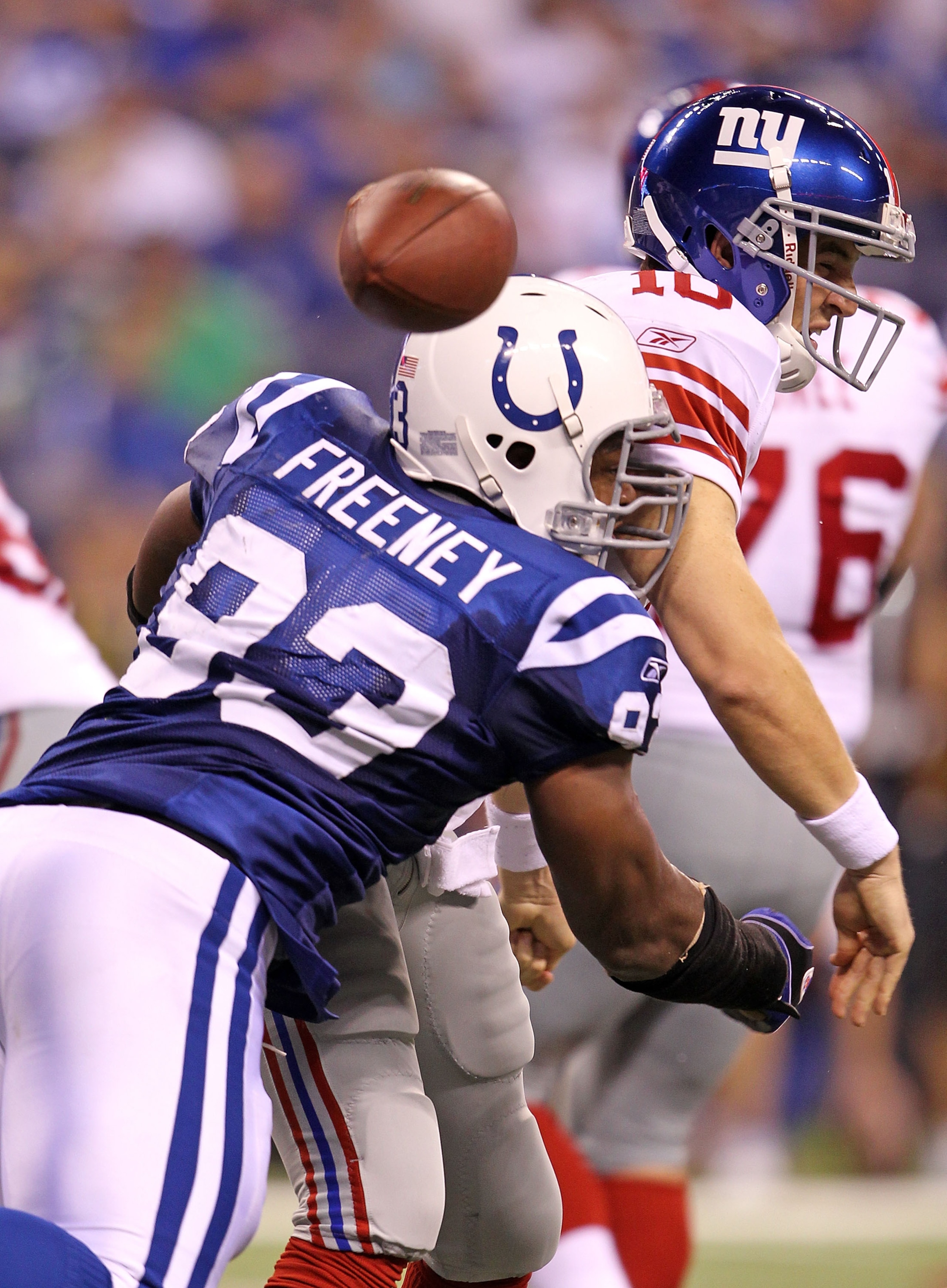 INDIANAPOLIS - SEPTEMBER 19: Dwight Freeney #93 of the Indianapolis Colts hits Eli Manning #10 of the New York Giants causing a fumble during the NFL game at Lucas Oil Stadium on September 19, 2010 in Indianapolis, Indiana. (Photo by Andy Lyons/Getty Im INDIANAPOLIS - SEPTEMBER 19: Dwight Freeney #93 of the Indianapolis Colts hits Eli Manning #10 of the New York Giants causing a fumble during the NFL game at Lucas Oil Stadium on September 19, 2010 in Indianapolis, Indiana. (Photo by Andy Lyons/Getty Im