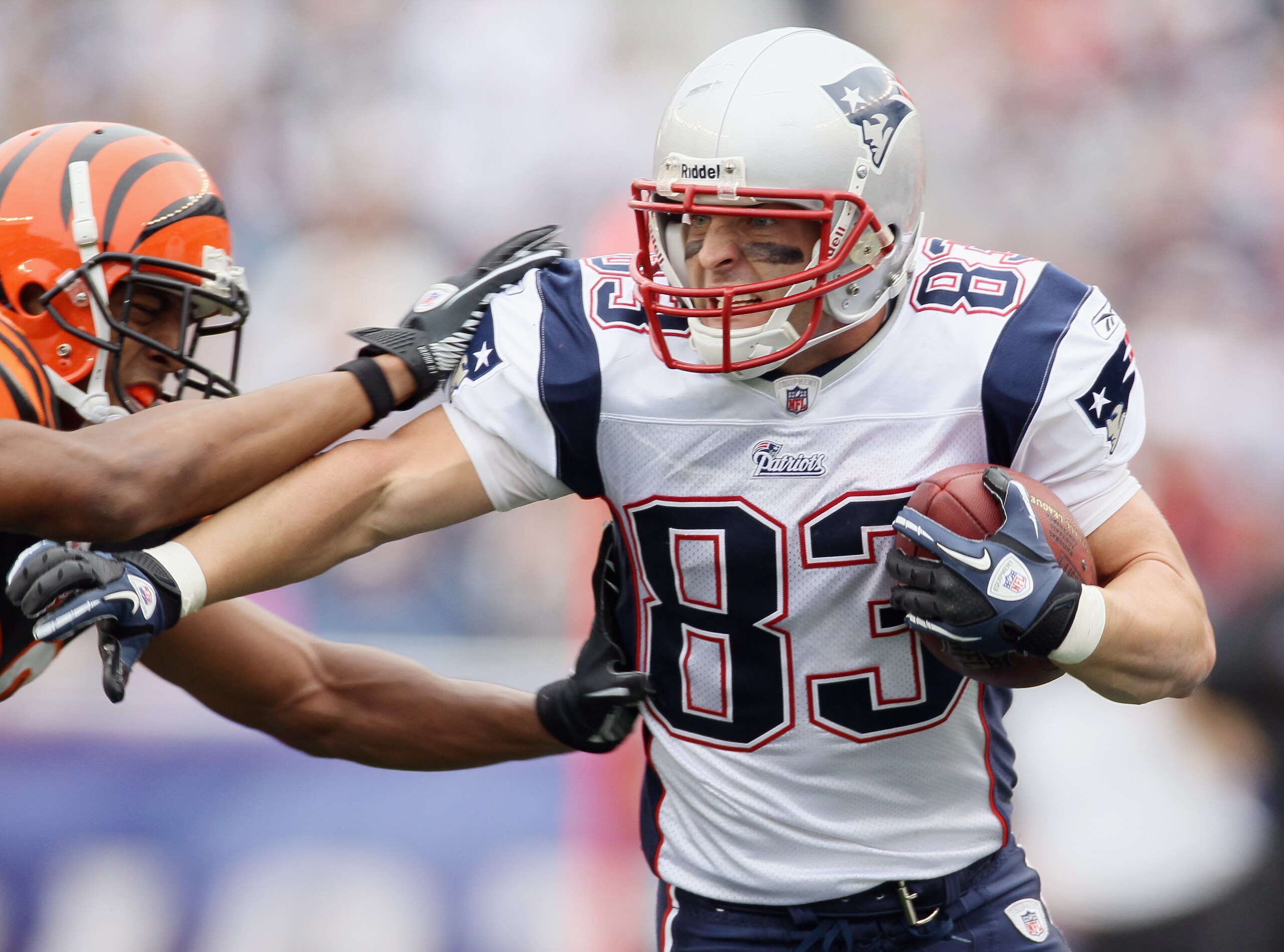 FOXBORO, MA - SEPTEMBER 12: Wes Welker #83 of the New England Patriots carries the ball as Leon Hall #29 of the Cincinnati Bengals defends during the NFL season opener on September 12, 2010 at Gillette Stadium in Foxboro, Massachusetts. The Patriots defe FOXBORO, MA - SEPTEMBER 12: Wes Welker #83 of the New England Patriots carries the ball as Leon Hall #29 of the Cincinnati Bengals defends during the NFL season opener on September 12, 2010 at Gillette Stadium in Foxboro, Massachusetts. The Patriots defe