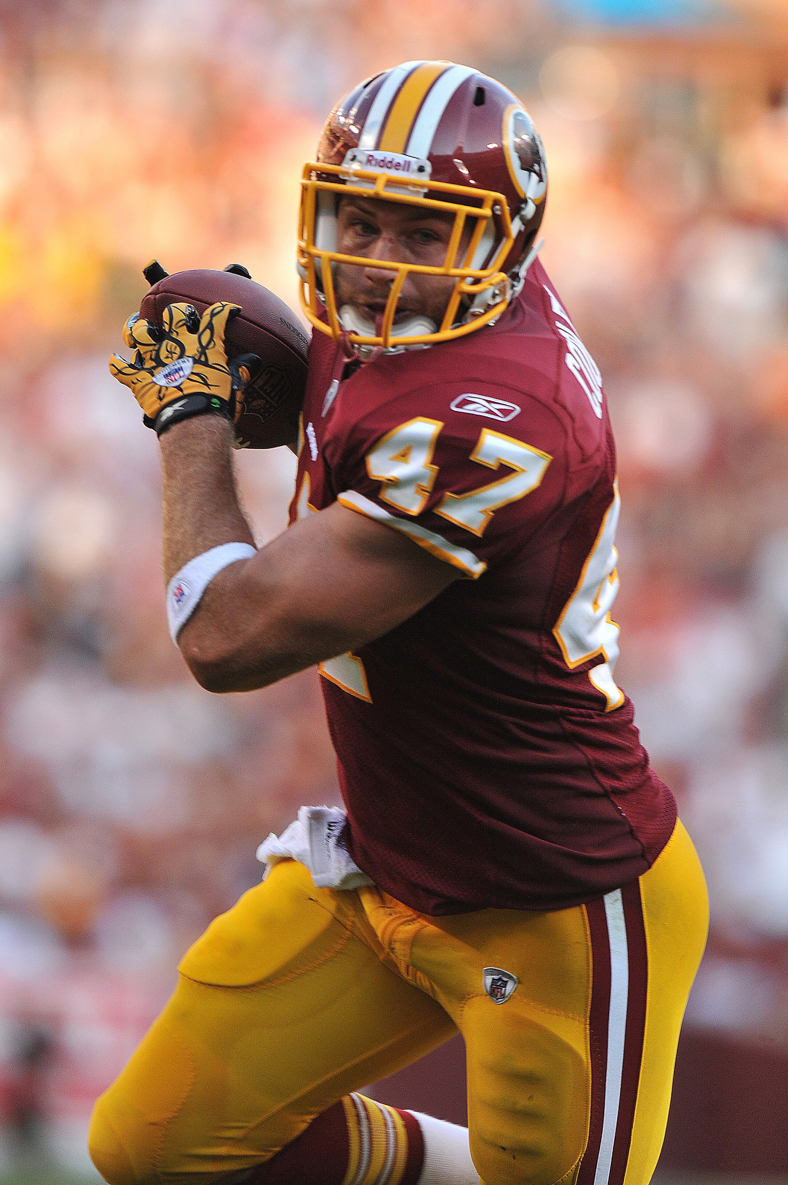 LANDOVER - SEPTEMBER 19: Chris Cooley #47 of the Washington Redskins runs the ball in for a touchdown against the Houston Texans at FedExField on September 19, 2010 in Landover, Maryland. The Texans defeated the Redskins 30-27 in overtime. (Photo by Larr LANDOVER - SEPTEMBER 19: Chris Cooley #47 of the Washington Redskins runs the ball in for a touchdown against the Houston Texans at FedExField on September 19, 2010 in Landover, Maryland. The Texans defeated the Redskins 30-27 in overtime. (Photo by Larr