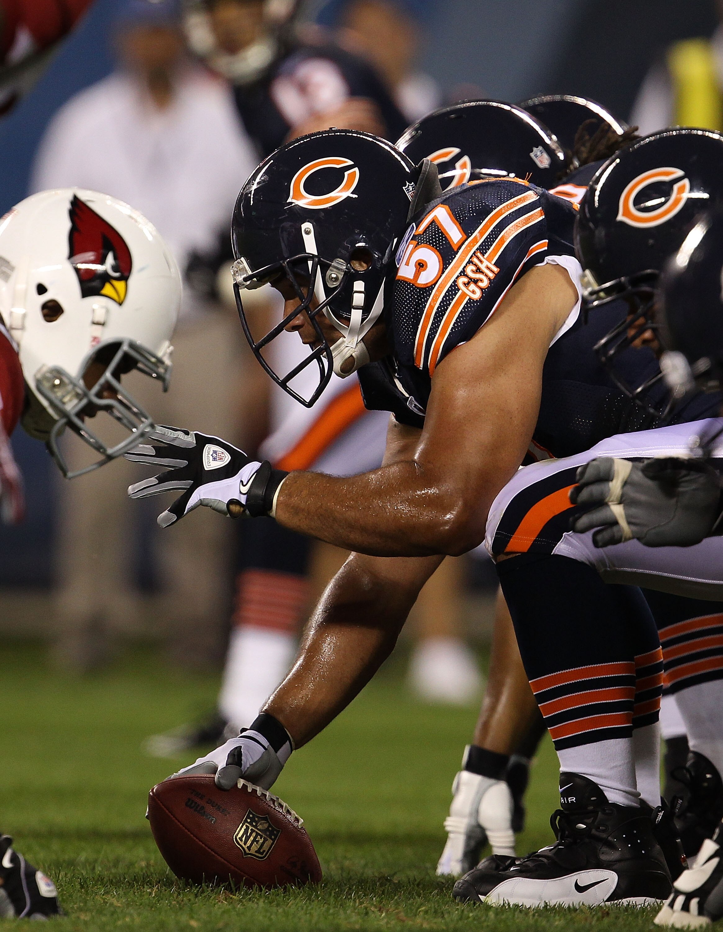 CHICAGO - AUGUST 28: Olin Kreutz #57 of the Chicago Bears waits to snap the ball against the Arizona Cardinals during a preseason game at Soldier Field on August 28, 2010 in Chicago, Illinois. The Cardinals defeated the Bears 14-9. (Photo by Jonathan Dani