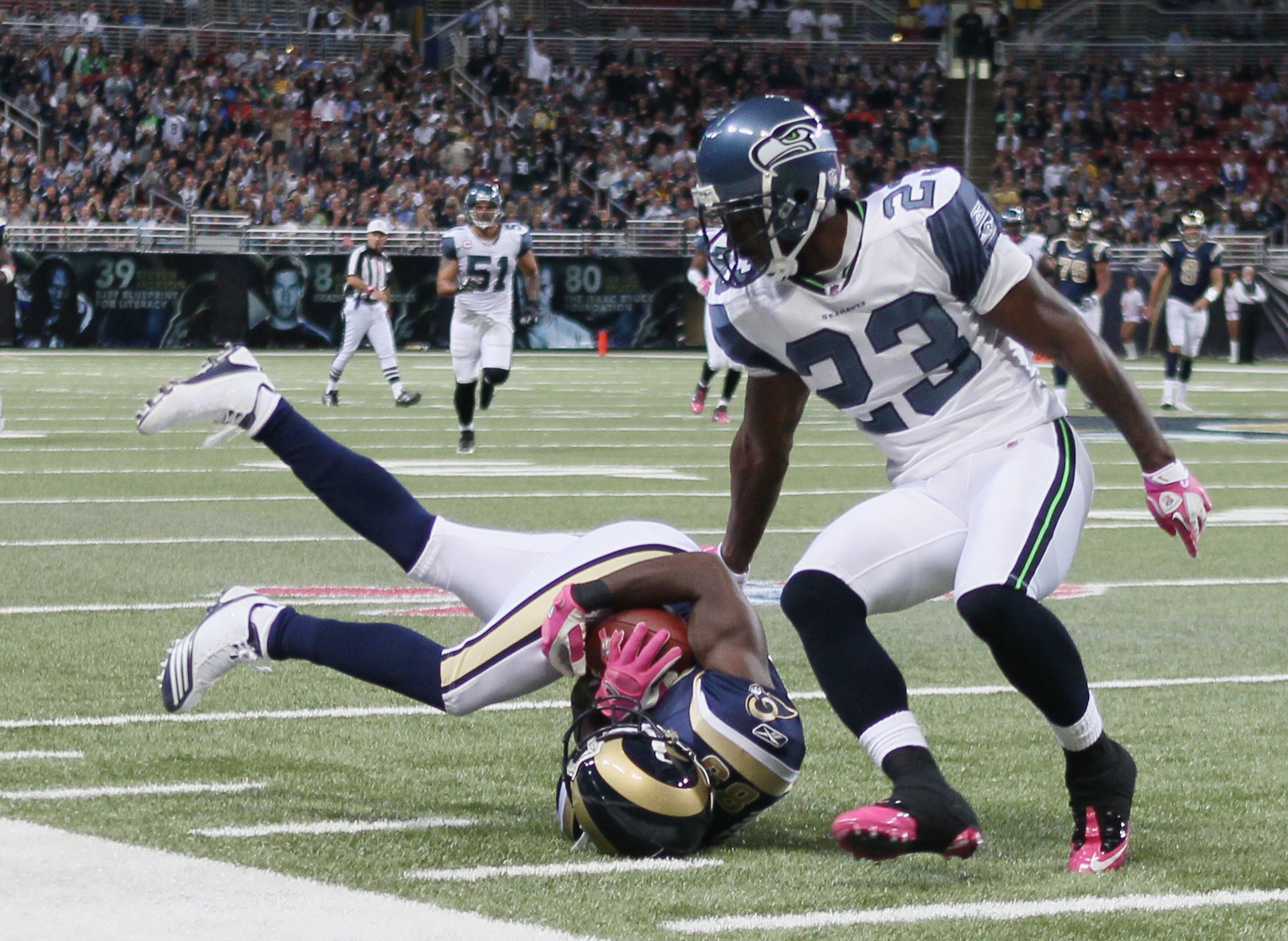 ST. LOUIS - OCTOBER 03:  Mark Clayton #89 of the St. Louis Rams makes the catch as Marcus Trufant #23 of the Seattle Seahawks defends on October 3, 2010 at Edward Jones Dome in St. Louis, Missouri.  (Photo by Elsa/Getty Images)