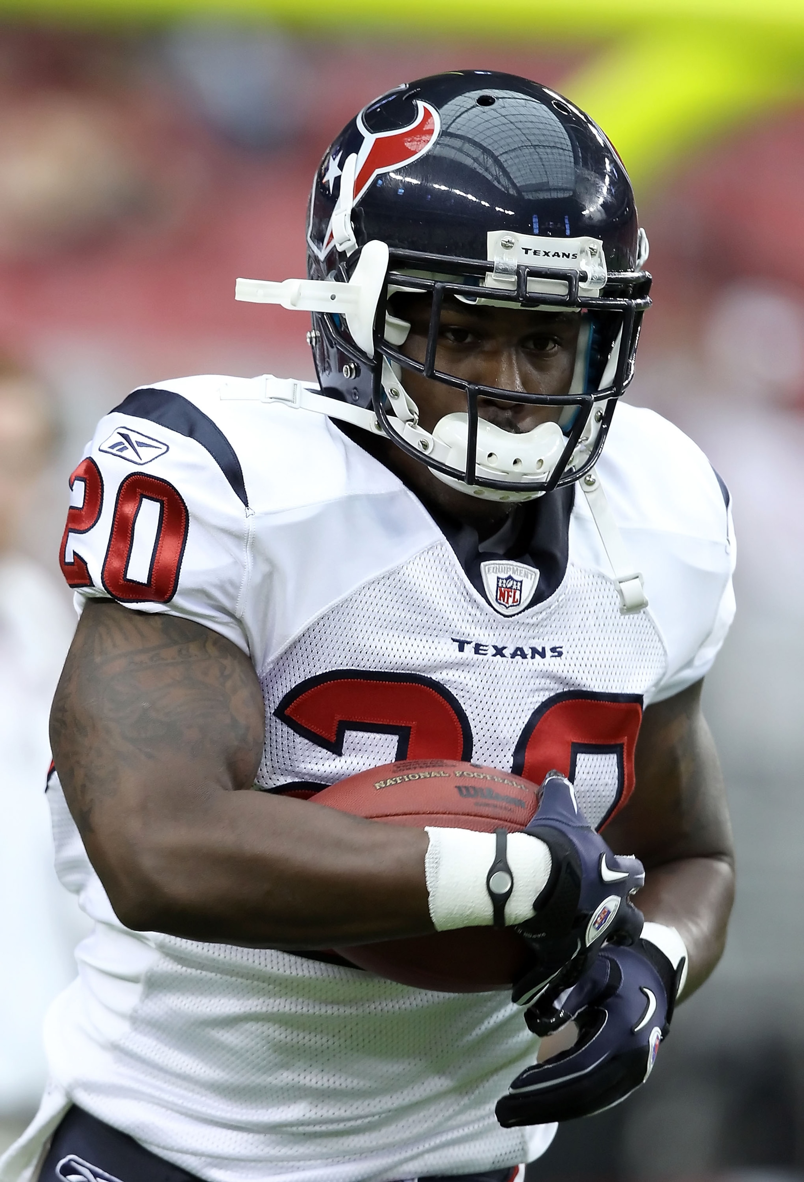 GLENDALE, AZ - AUGUST 14: Runningback Steve Slaton #20 of the Houston Texans carries the ball during warm ups to the preseason NFL game against the Arizona Cardinals at the University of Phoenix Stadium on August 14, 2010 in Glendale, Arizona. The Cardi GLENDALE, AZ - AUGUST 14: Runningback Steve Slaton #20 of the Houston Texans carries the ball during warm ups to the preseason NFL game against the Arizona Cardinals at the University of Phoenix Stadium on August 14, 2010 in Glendale, Arizona. The Cardi