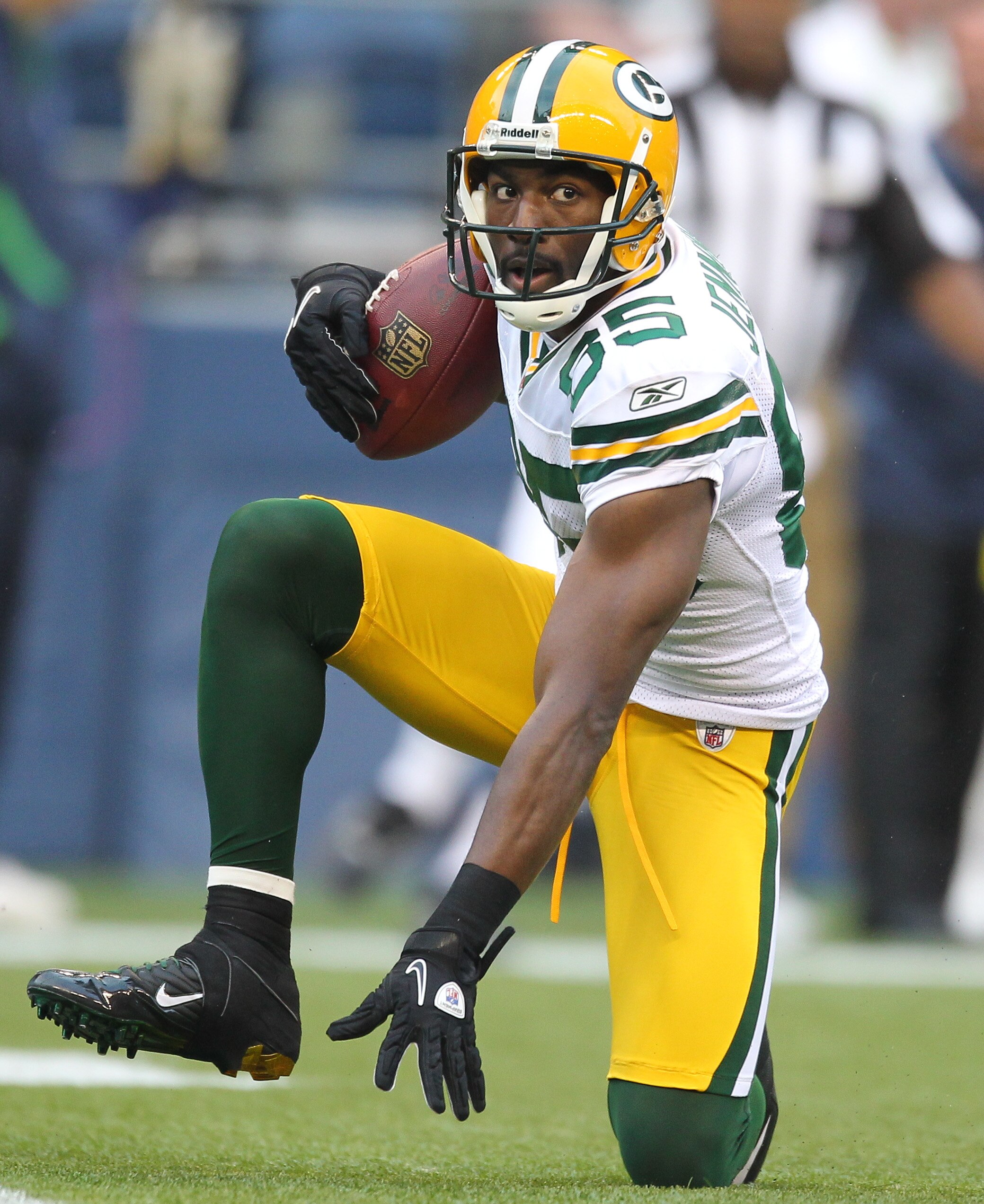 SEATTLE - AUGUST 21:  Wide receiver Greg Jennings #85 of the Green Bay Packers gets up after making a diving catch during the preseason game against Earl Thomas #29 of the Seattle Seahawks at Qwest Field on August 21, 2010 in Seattle, Washington. (Photo b