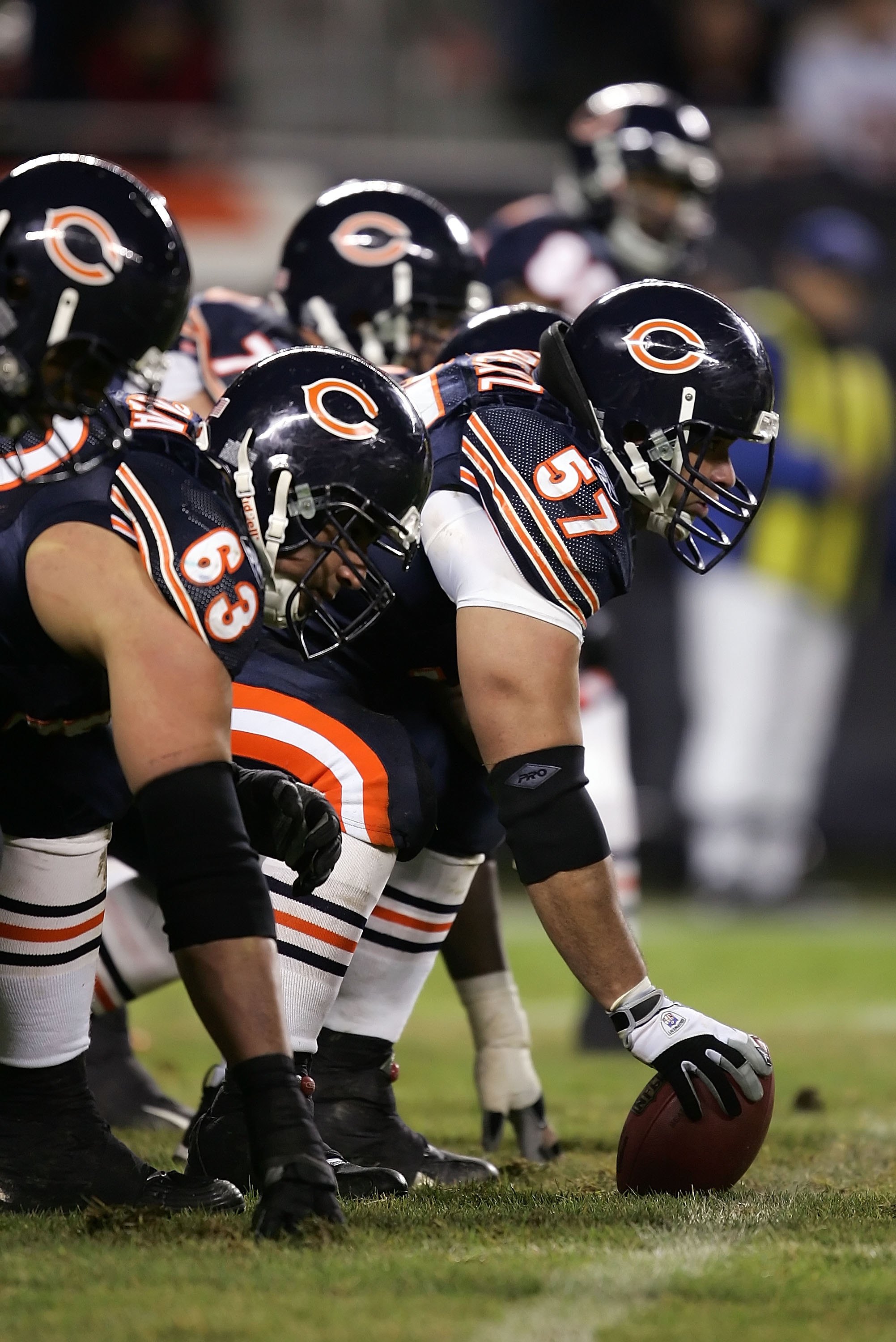 Chicago Bears center Olin Kreutz (57) and teammates Terrence