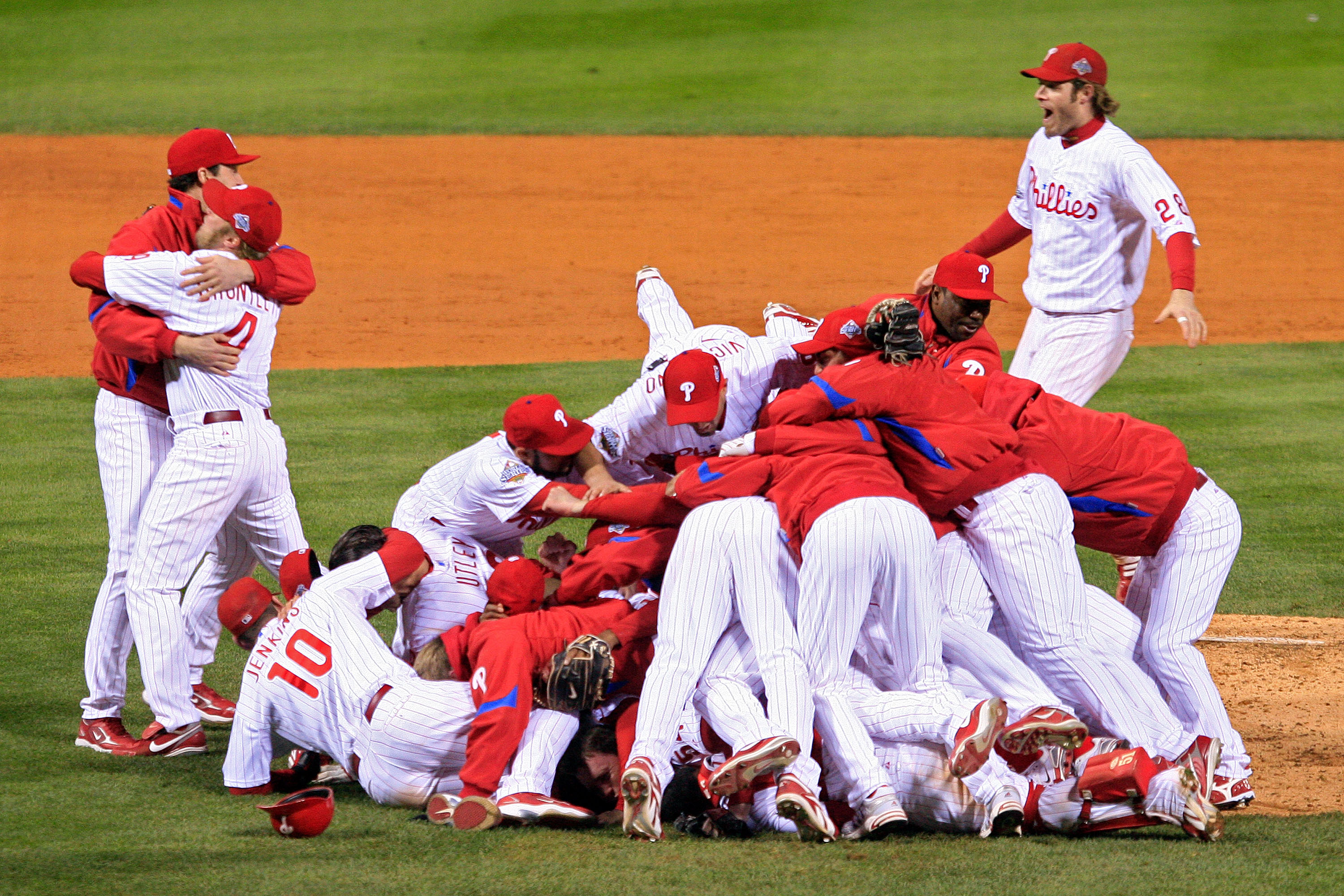 PHILADELPHIA - OCTOBER 29:  The Philadelphia Phillies pile on top of closing pitcher Brad Lidge #54 after they won 4-3 to win the World Series against the Tampa Bay Rays during the continuation of game five of the 2008 MLB World Series on October 29, 2008