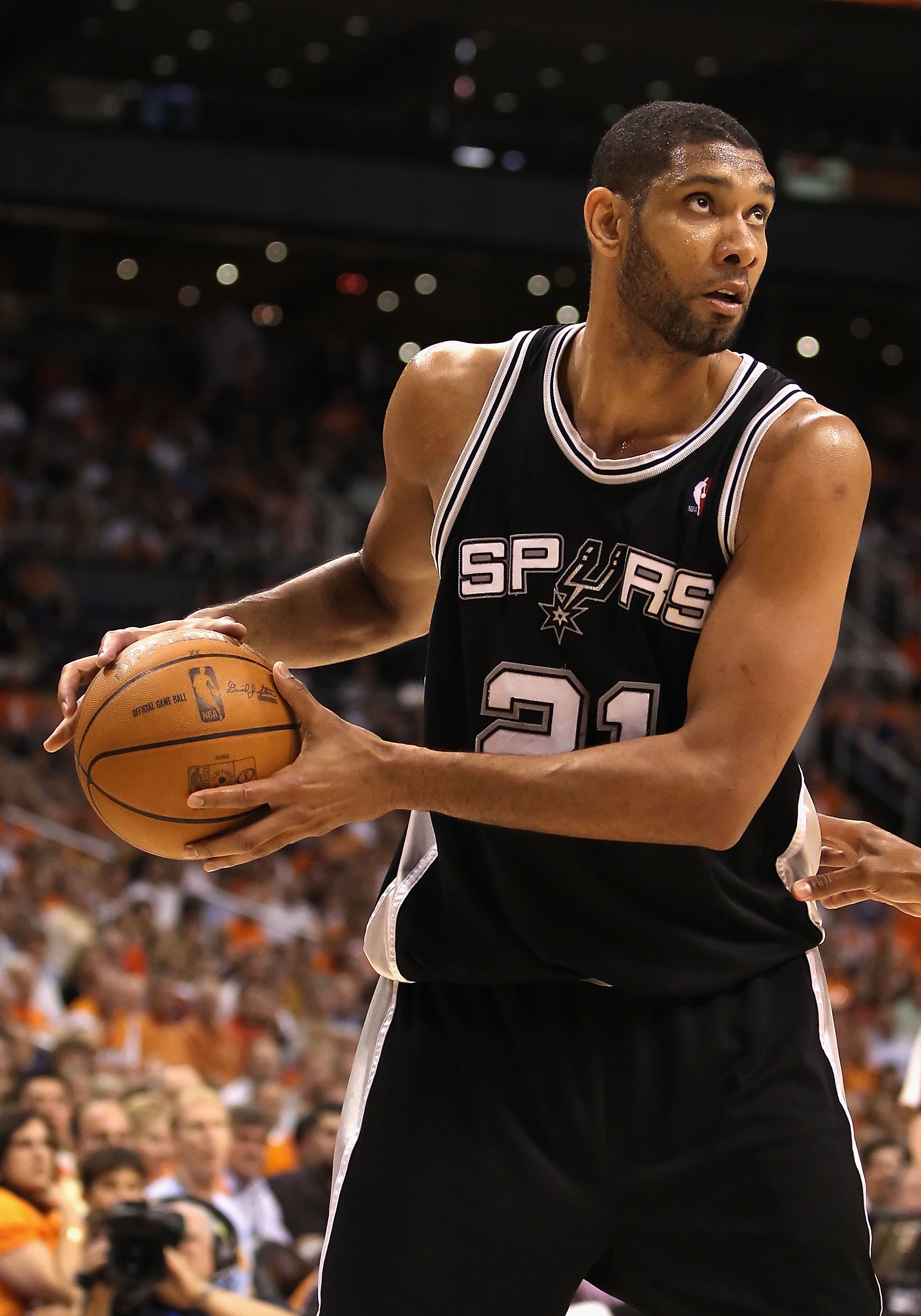 PHOENIX - MAY 05:  Tim Duncan #21 of the San Antonio Spurs handles the ball during Game Two of the Western Conference Semifinals of the 2010 NBA Playoffs against the Phoenix Suns at US Airways Center on May 5, 2010 in Phoenix, Arizona. The team is wearing