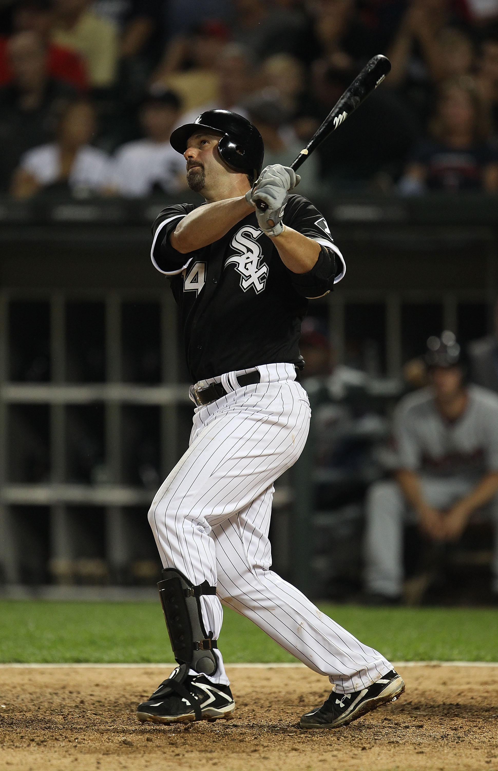 CHICAGO - AUGUST 10: Paul Konerko #14 of the Chicago White Sox hits a double against the Minnesota Twins at U.S. Cellular Field on August 10, 2010 in Chicago, Illinois. The Twins defeated the White Sox 12-6. (Photo by Jonathan Daniel/Getty Images)