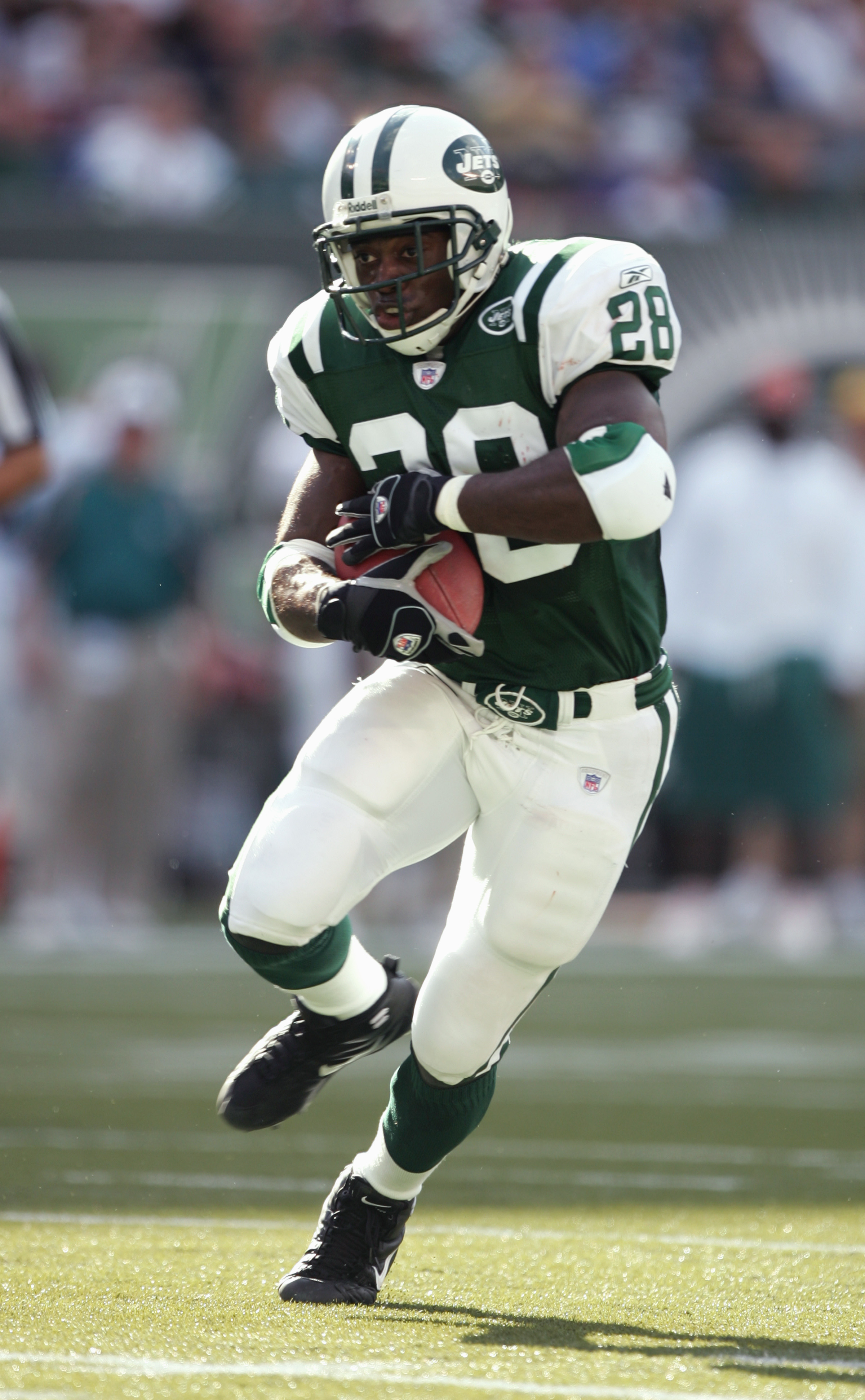 Washington Redskins running back Larry Smith (38) carries the ball during  the game against the Miami Dolphins at RFK Stadium in Washington, DC on  October 13, 1974. Pictured from left to right