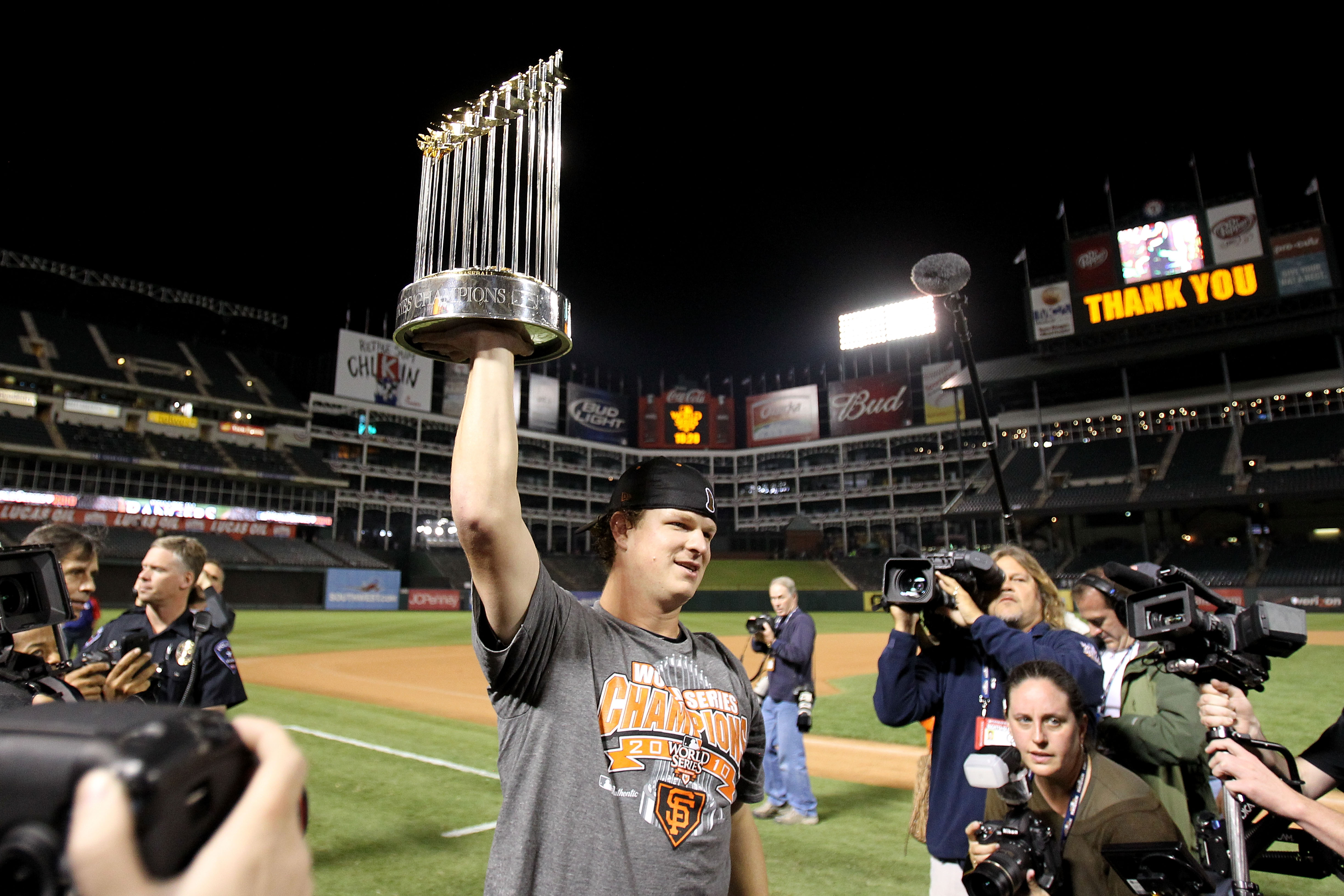 ARLINGTON, TX - NOVEMBER 01:  Matt Cain of the San Francisco Giants celebrates with the World Series Championship trophy out to the field after they won 3-1 against the Texas Rangers in Game Five of the 2010 MLB World Series at Rangers Ballpark in Arlingt