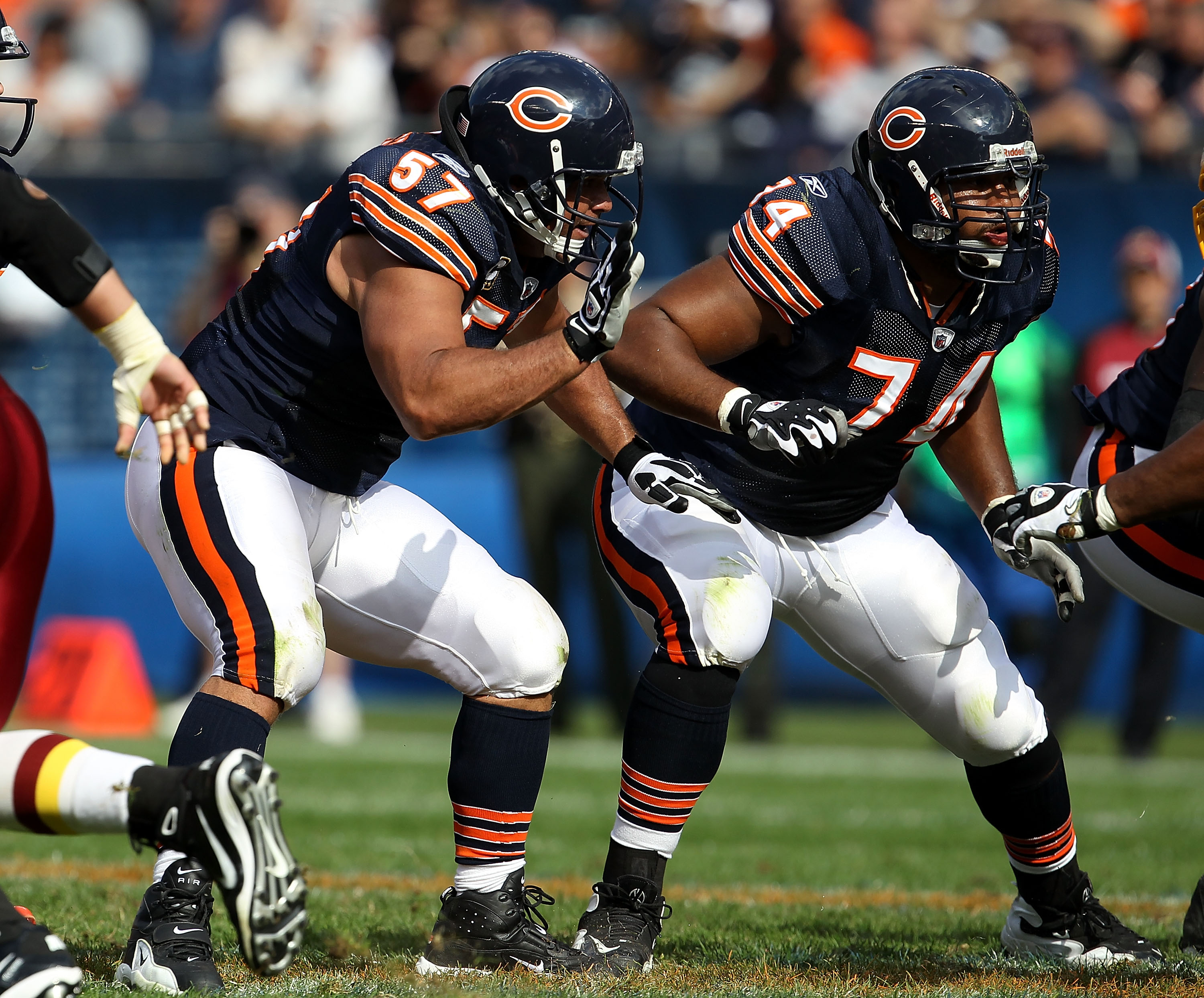 Quarterback Jay Cutler (6) and center Olin Kreutz (57) share a