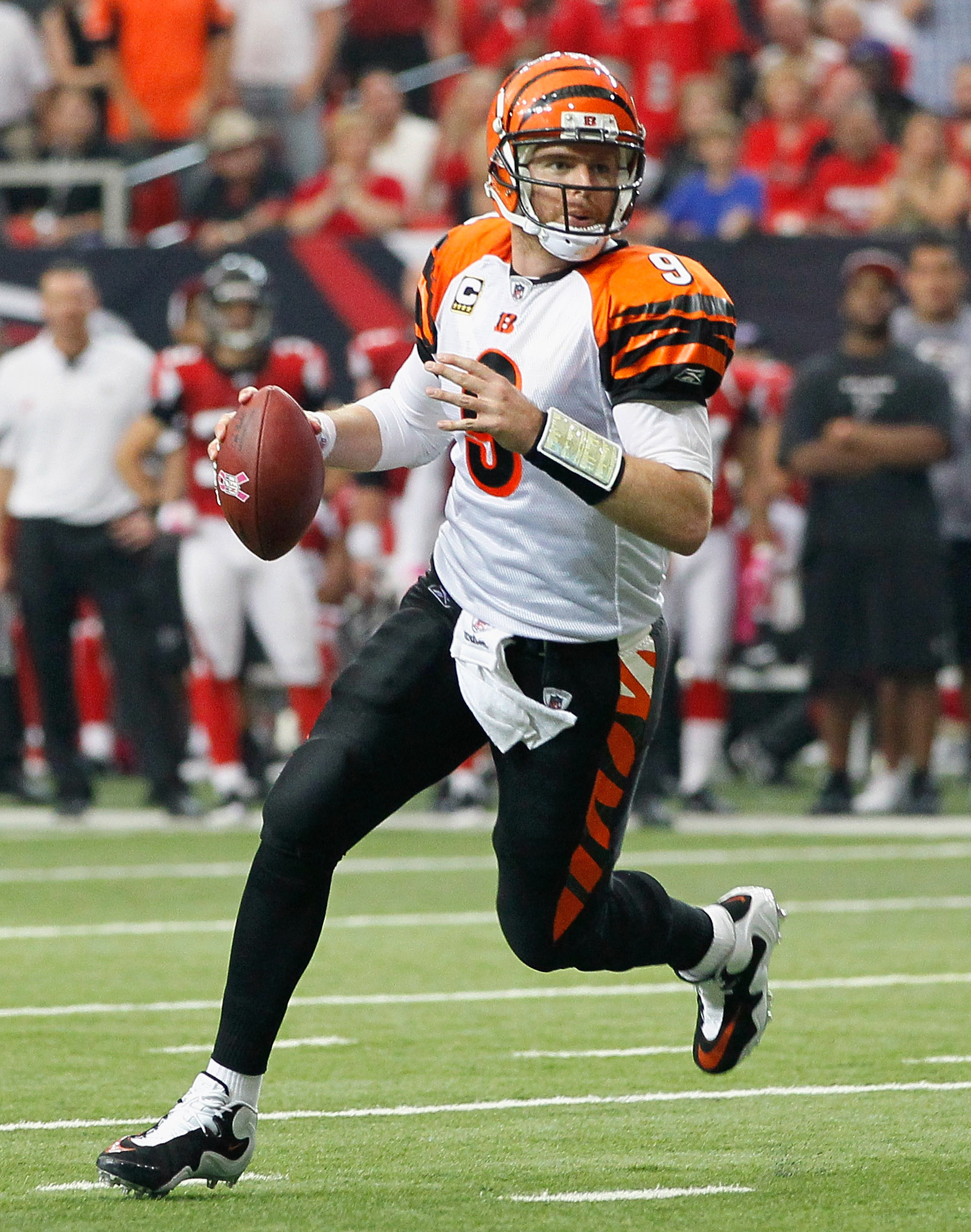 ATLANTA - OCTOBER 24:  Quarterback Carson Palmer #9 of the Cincinnati Bengals rushes out of the pocket against the Atlanta Falcons at Georgia Dome on October 24, 2010 in Atlanta, Georgia.  (Photo by Kevin C. Cox/Getty Images)
