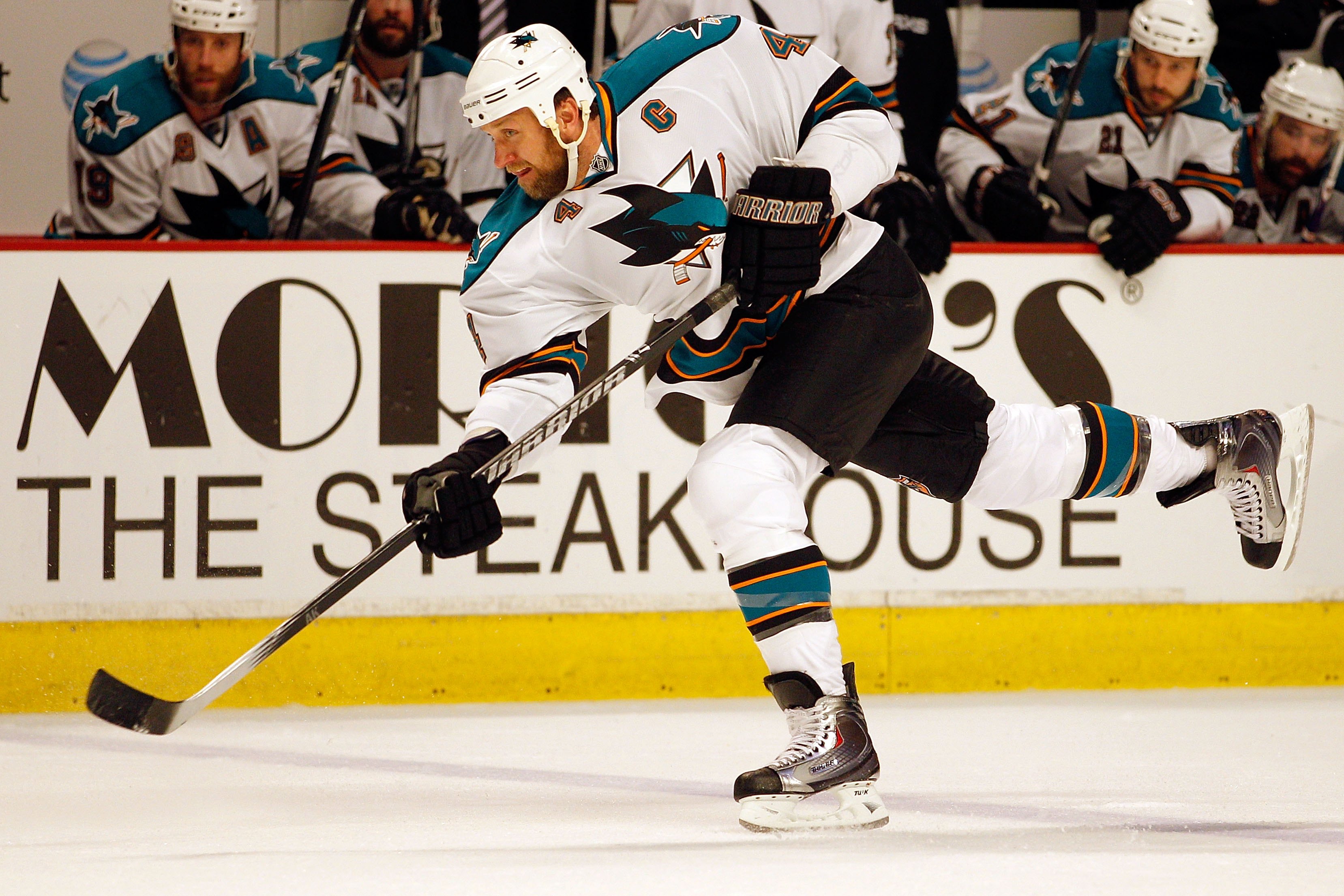 CHICAGO - MAY 21:  Rob Blake #4 of the San Jose Sharks slaps the puck while taking on the Chicago Blackhawks in Game Three of the Western Conference Finals during the 2010 NHL Stanley Cup Playoffs at the United Center on May 21, 2010 in Chicago, Illinois.