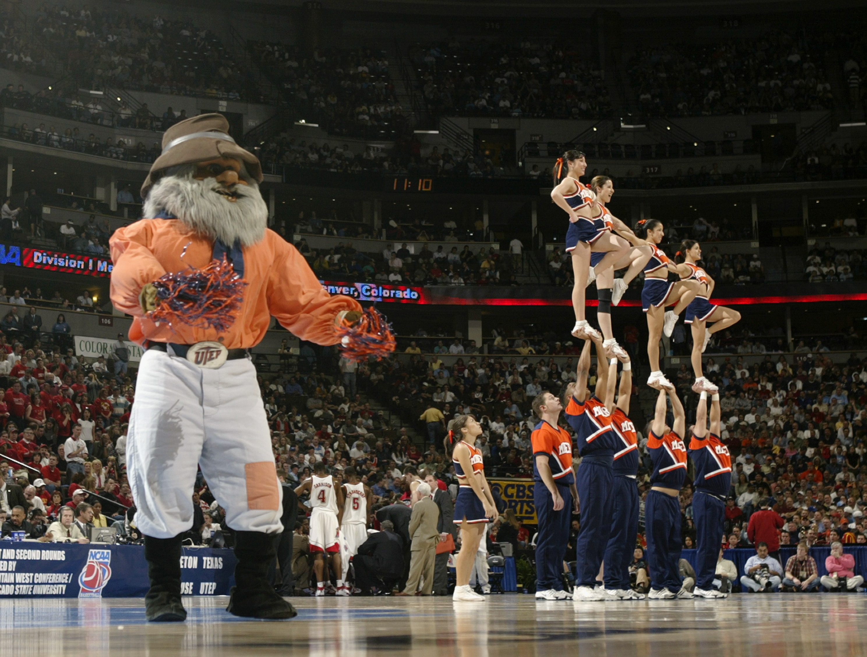 DENVER - MARCH 18:  The University of Texas El Paso Miners mascot and cheerleaders perform during the first round game of the NCAA Division I Men's Basketball Tournament against the Maryland Terrapins at the Pepsi Center on March 18, 2004 in Denver, Color