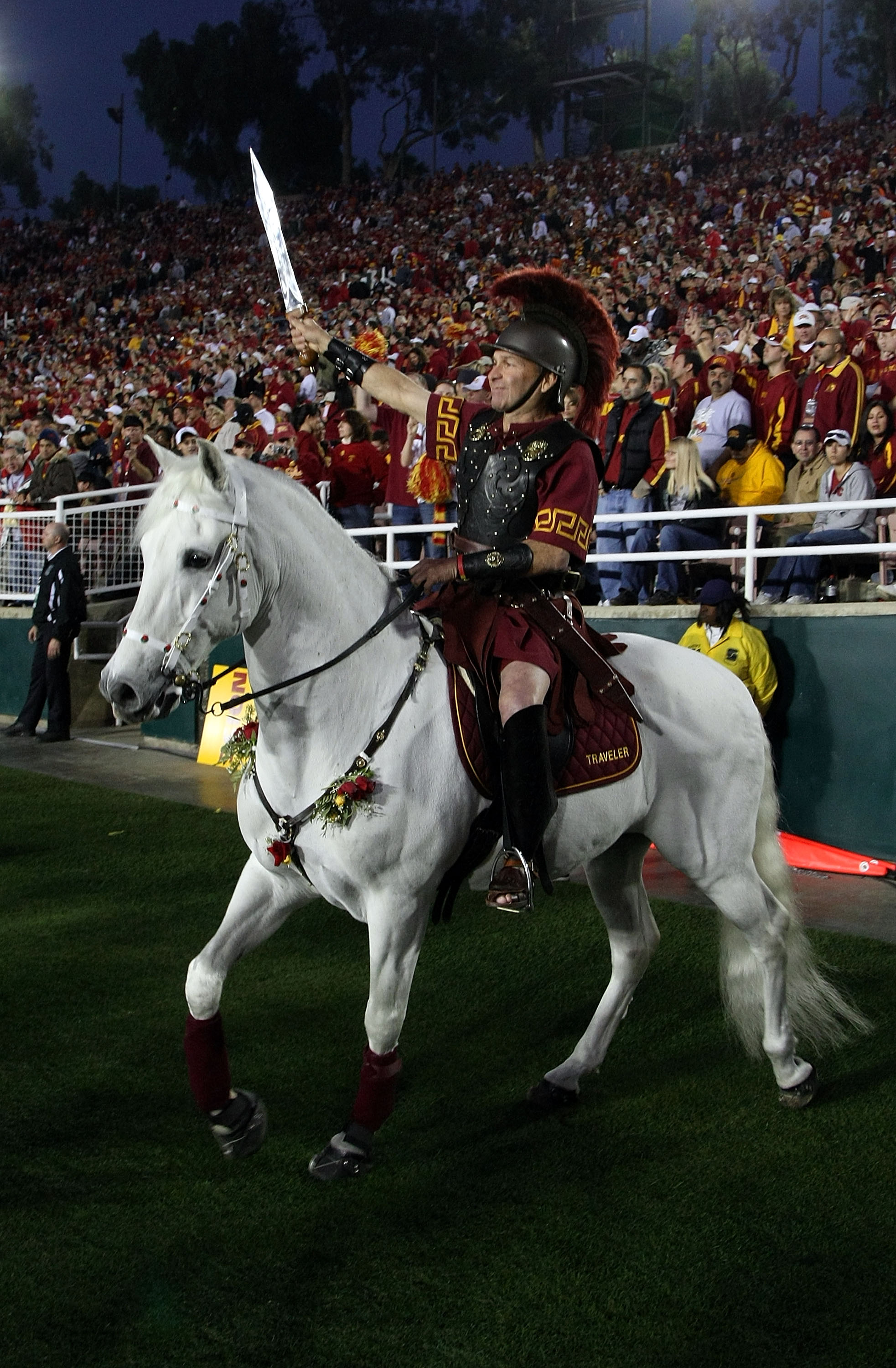 PASADENA, CA - JANUARY 01:  USC Trojans Hector Aguilar trots horse Traveler on the sideline during the Rose Bowl presented by Citi between the USC Trojans and the Illinois Fighting Illini at the Rose Bowl on January 1, 2008 in Pasadena, California.  The T