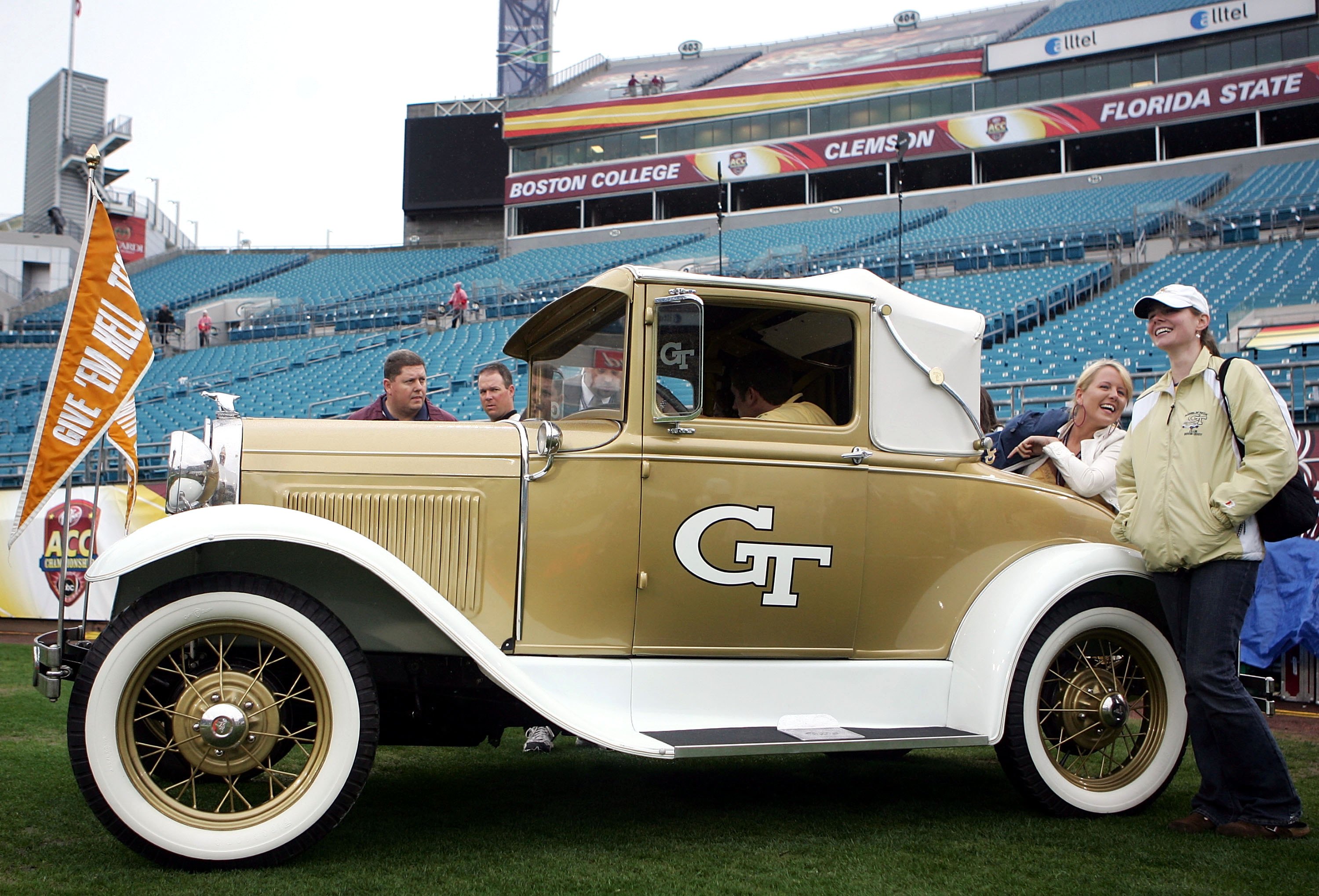 JACKSONVILLE, FL - DECEMBER 02:  Georgia Tech Yellow Jackets fans drive onto the field in an antique car prior to a game against the Wake Forest Demon Deacons during the Atlantic Coast Conference Championship on December 2, 2006 at Alltel Stadium in Jacks