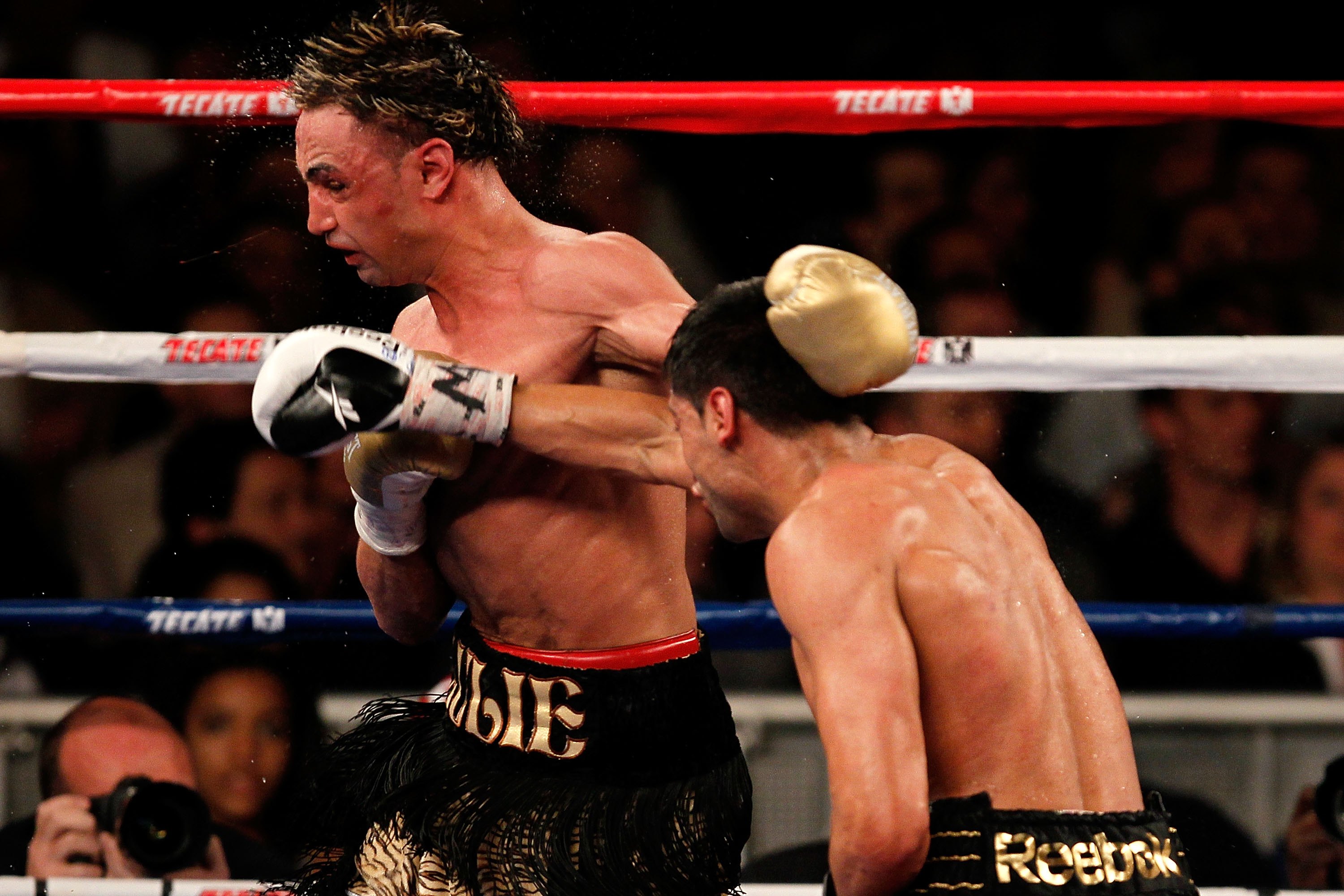 NEW YORK - MAY 15: Amir Khan (R) of Great Britain hits Paulie Malignaggi during the WBA light welterweight title fight at Madison Square Garden on May 15, 2010 in New York City. (Photo by Chris Trotman/Getty Images)