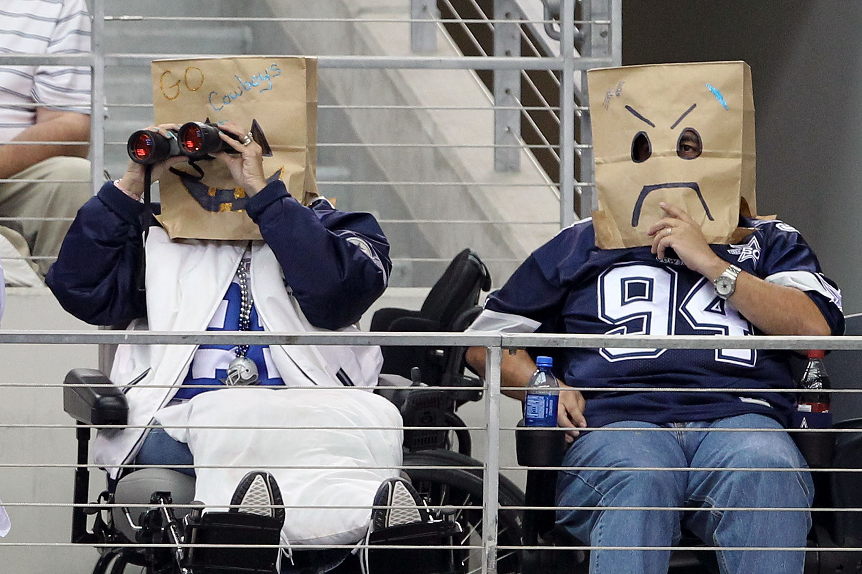 ARLINGTON, TX - OCTOBER 31:  Fans of the Dallas Cowboys wear brown paper bags over their head as they watch the Cowboys play against the Jacksonville Jaguars at Cowboys Stadium on October 31, 2010 in Arlington, Texas.  (Photo by Chris Chambers/Getty Image