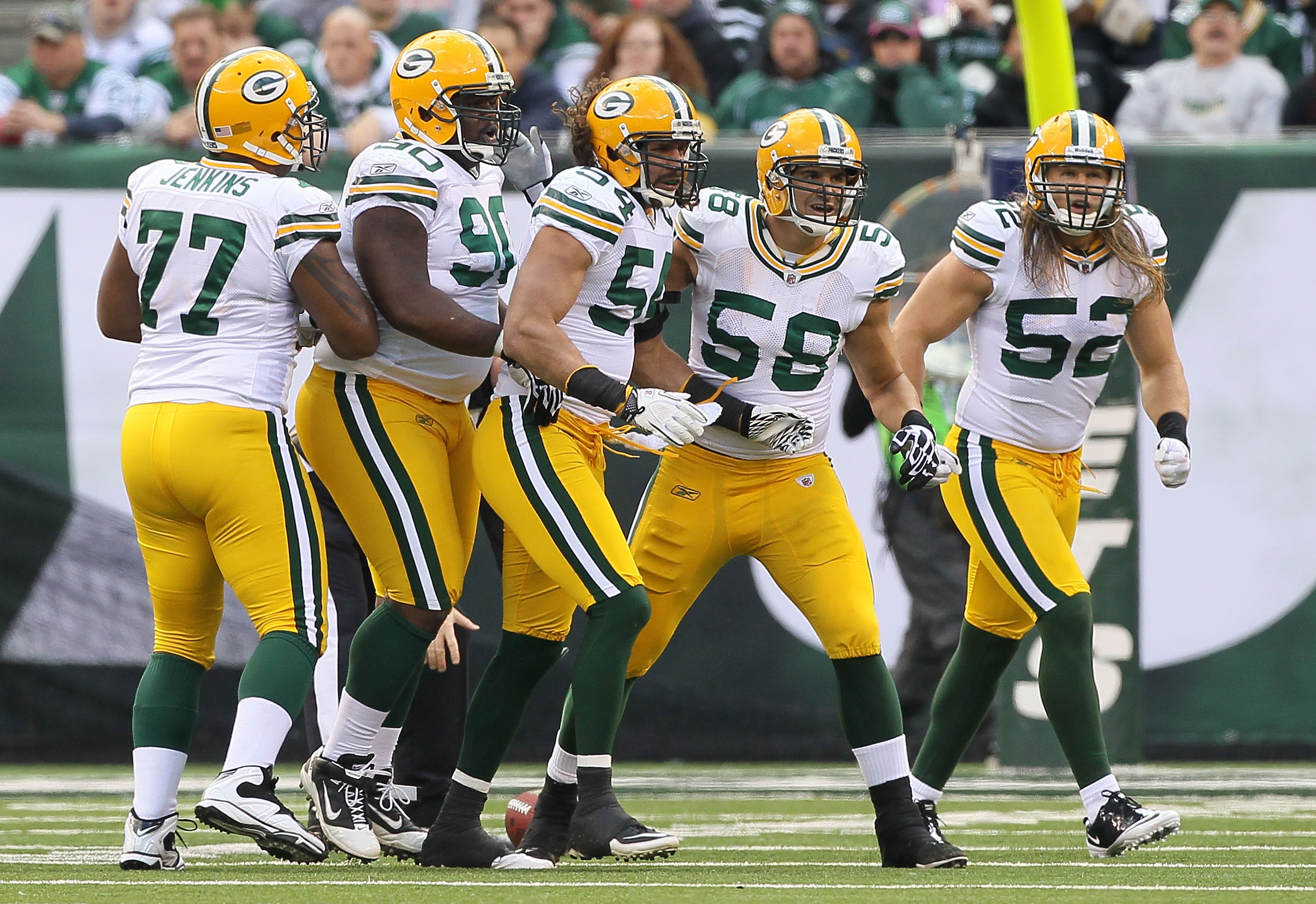 EAST RUTHERFORD, NJ - OCTOBER 31:  The defense of the Green Bay Packers celebrate a play against the New York Jets on October 31, 2010 at the New Meadowlands Stadium in East Rutherford, New Jersey.  (Photo by Jim McIsaac/Getty Images)