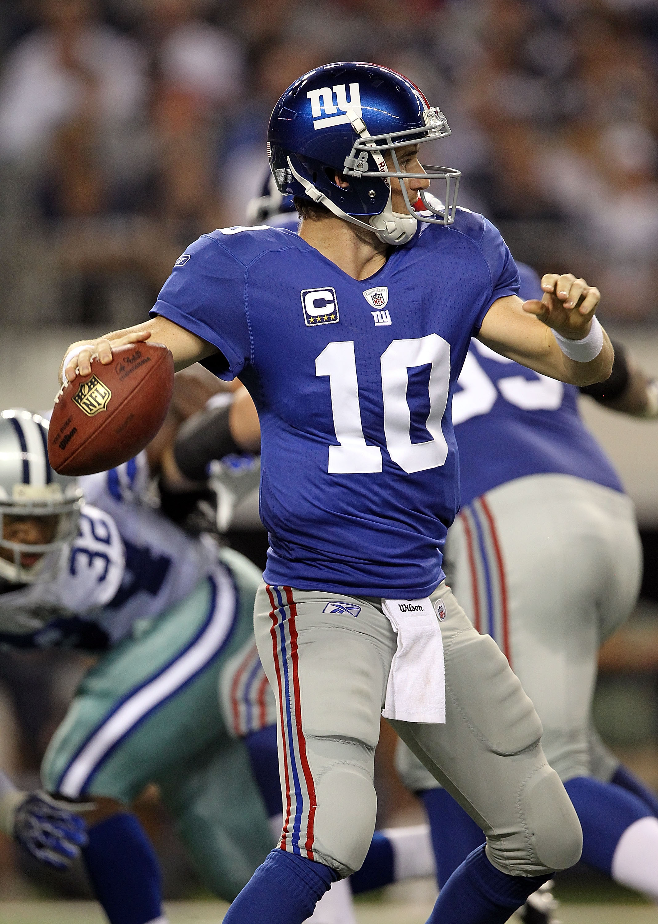 ARLINGTON, TX - OCTOBER 25:  Quarterback Eli Manning #10 of the New York Giants looks to pass against the Dallas Cowboys at Cowboys Stadium on October 25, 2010 in Arlington, Texas.  (Photo by Ronald Martinez/Getty Images)