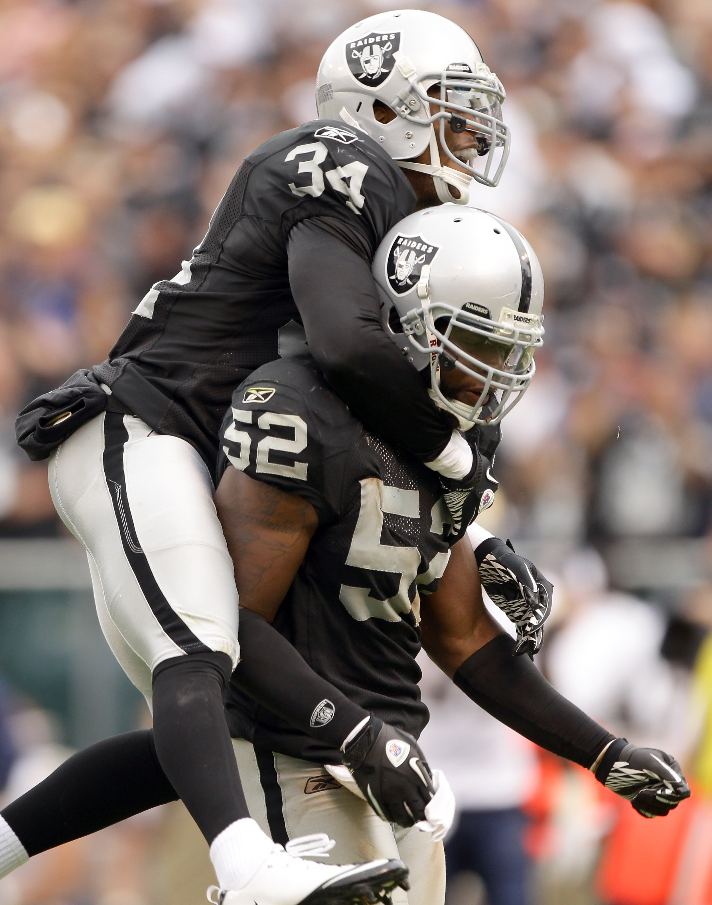 Oakland, California, USA. 13th Aug, 2012. Oakland Raiders defensive back  Mike Mitchell (34) celebrates early interception on Monday, August 13,  2012, in Oakland California. Cowboys defeated the Raiders 3-0 in a preseason