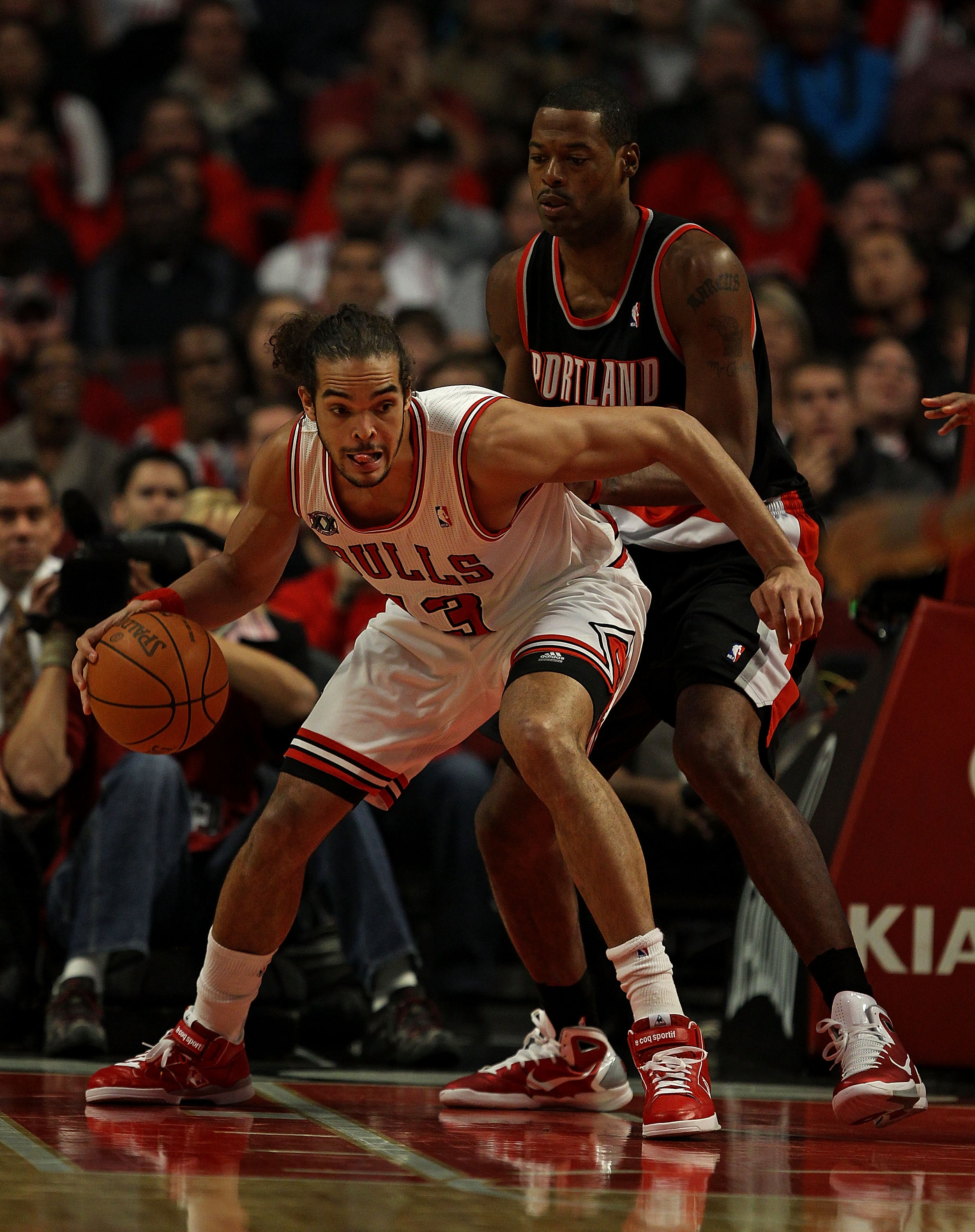 CHICAGO - NOVEMBER 01: Joakim Noah #13 of the Chicago Bulls moves against Marcus Camby #23 of the Portland Trail Blazers at the United Center on November 1, 2010 in Chicago, Illinois. The Bulls defeated the Trail Blazers 110-98. NOTE TO USER: User express
