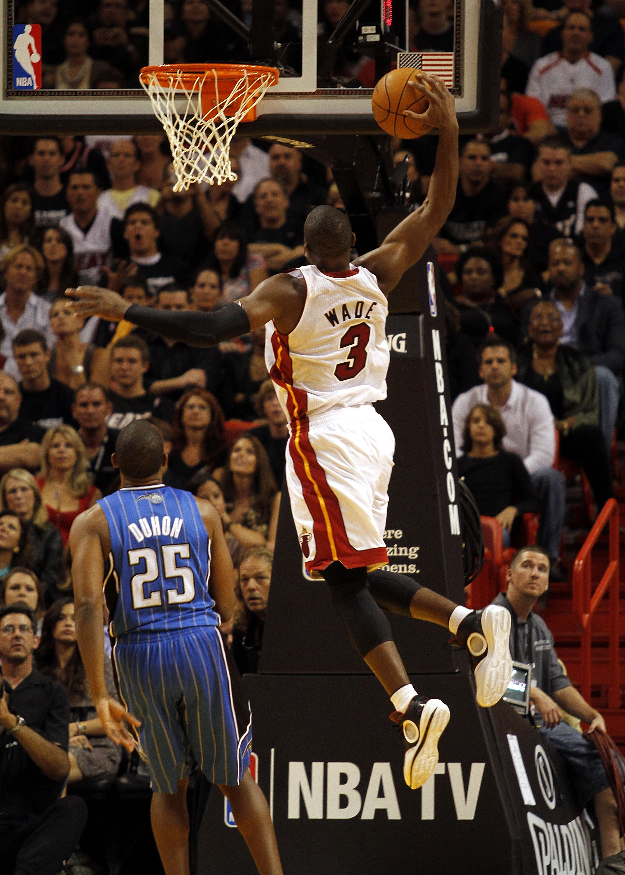 MIAMI - OCTOBER 29: Guard Dwyane Wade #3 of the Miami Heat dunks against the Orlando Magic at American Airlines Arena on October 29, 2010 in Miami, Florida. NOTE TO USER: User expressly acknowledges and agrees that, by downloading and or using this ph