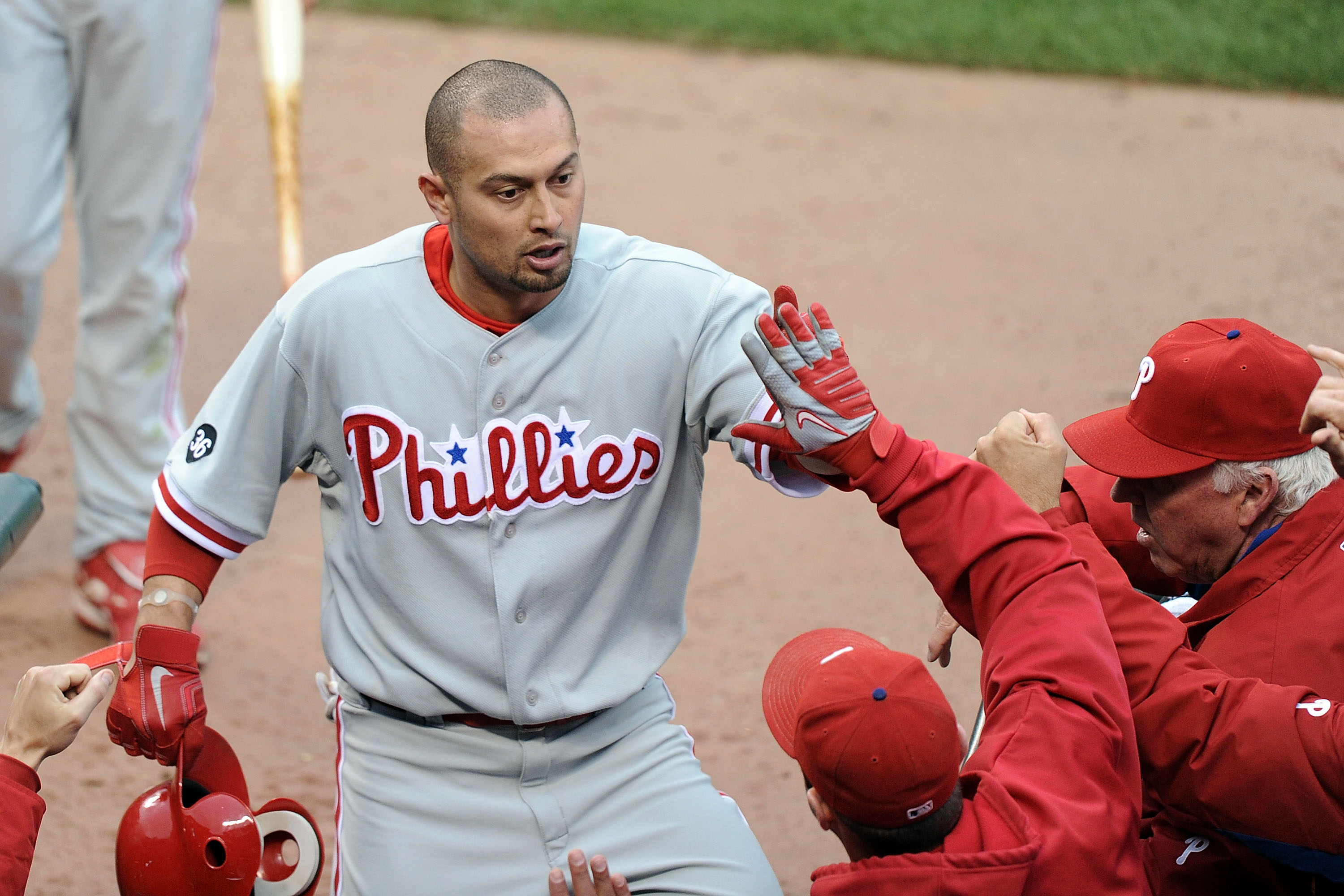 SAN FRANCISCO - OCTOBER 21:  Shane Victorino #8 of the Philadelphia Phillies celebrates in the dugout after scoring against the San Francisco Giants on a single by Placido Polanco #27 in the third inning of Game Five of the NLCS during the 2010 MLB Playof
