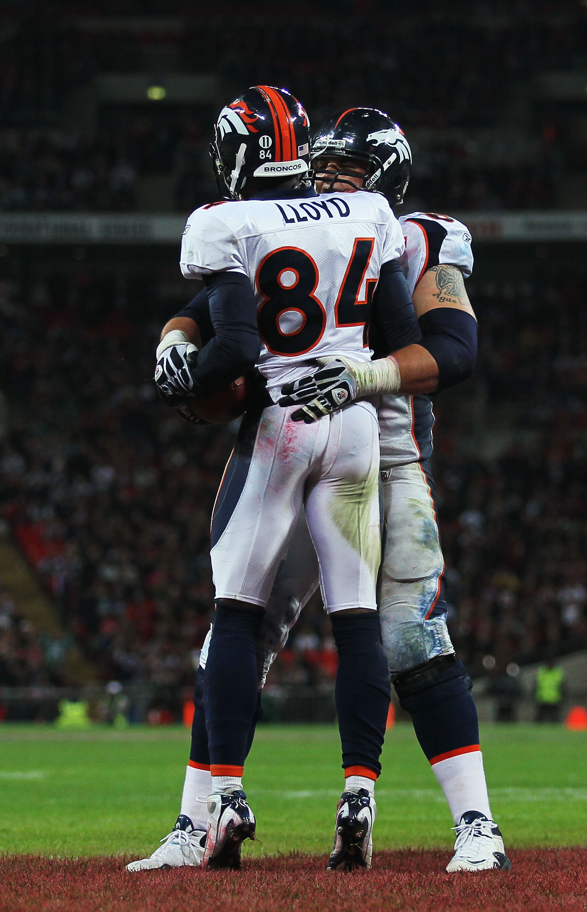 Denver Broncos Wide receiver Brandon Lloyd runs with the football during  their match with the San Francisco 49ers in the International NFL series  match at Wembley Stadium in London on October 31