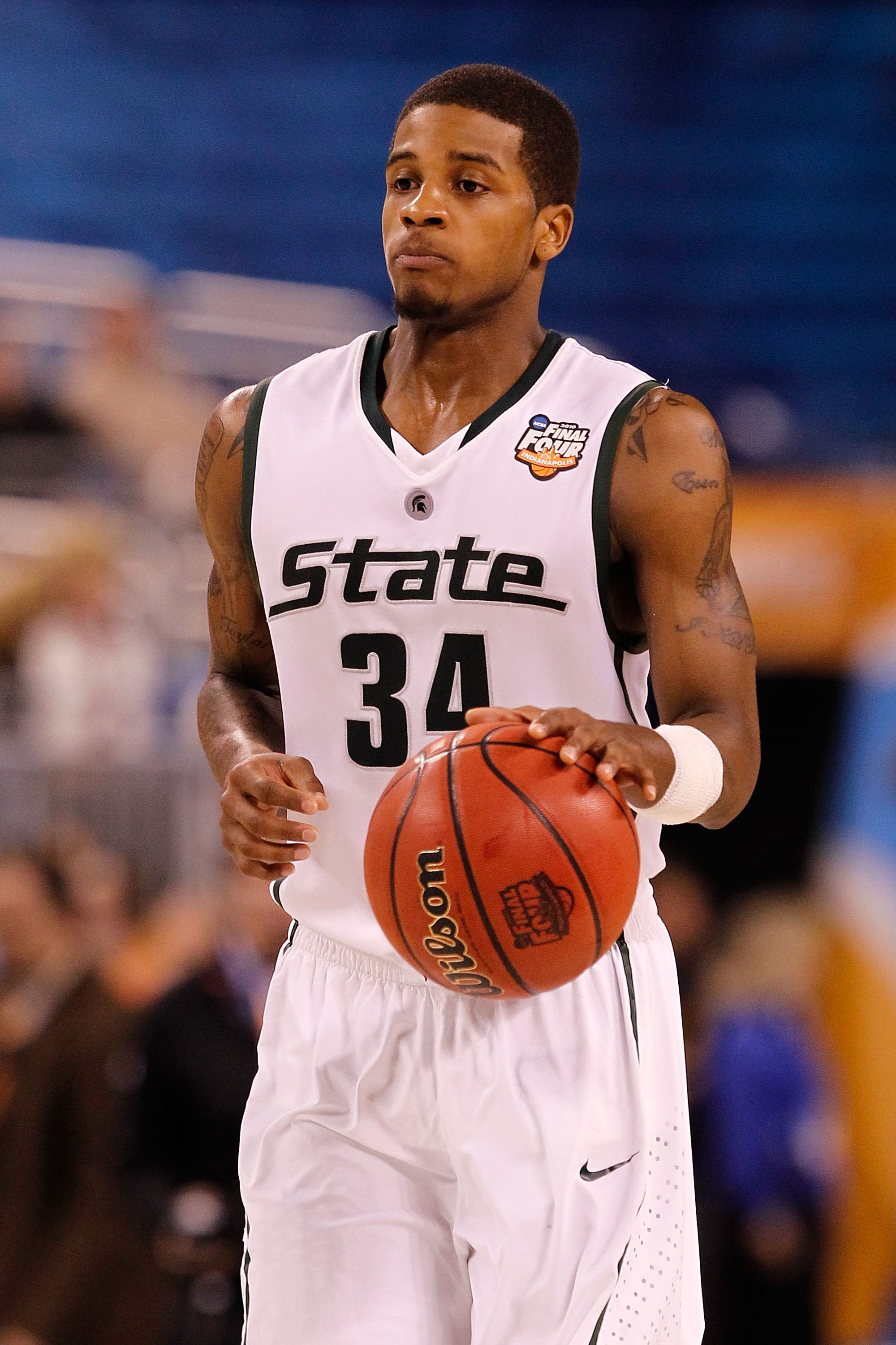 Butler center Andrew Smith (44) puts up a go-ahead score against Pittsburgh  guard Ashton Gibbs (12) with only seconds remaining in a third-round game  of the 2011 NCAA Men's Basketball Championship tournament