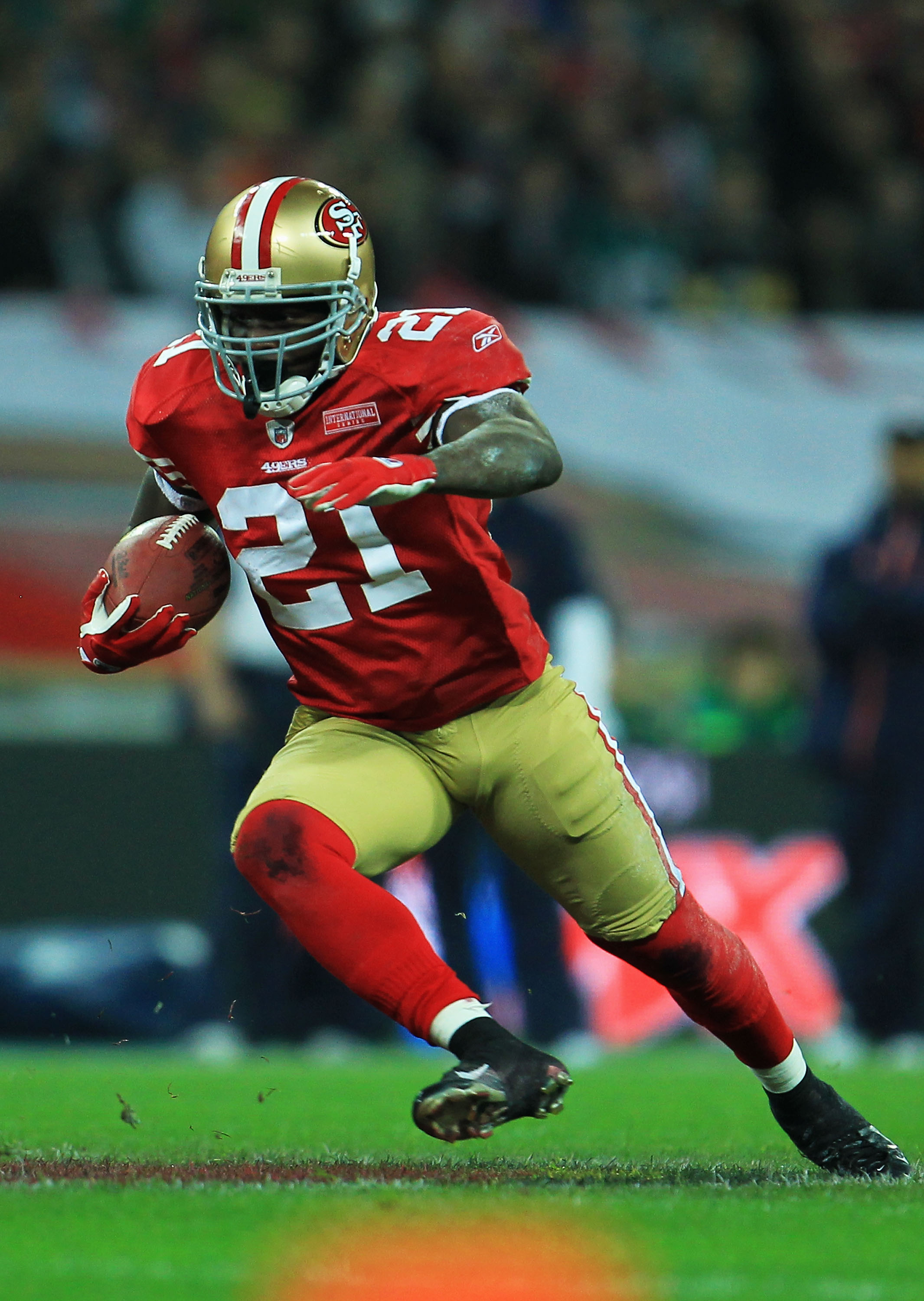 Denver Broncos Wide receiver Brandon Lloyd runs with the football during  their match with the San Francisco 49ers in the International NFL series  match at Wembley Stadium in London on October 31