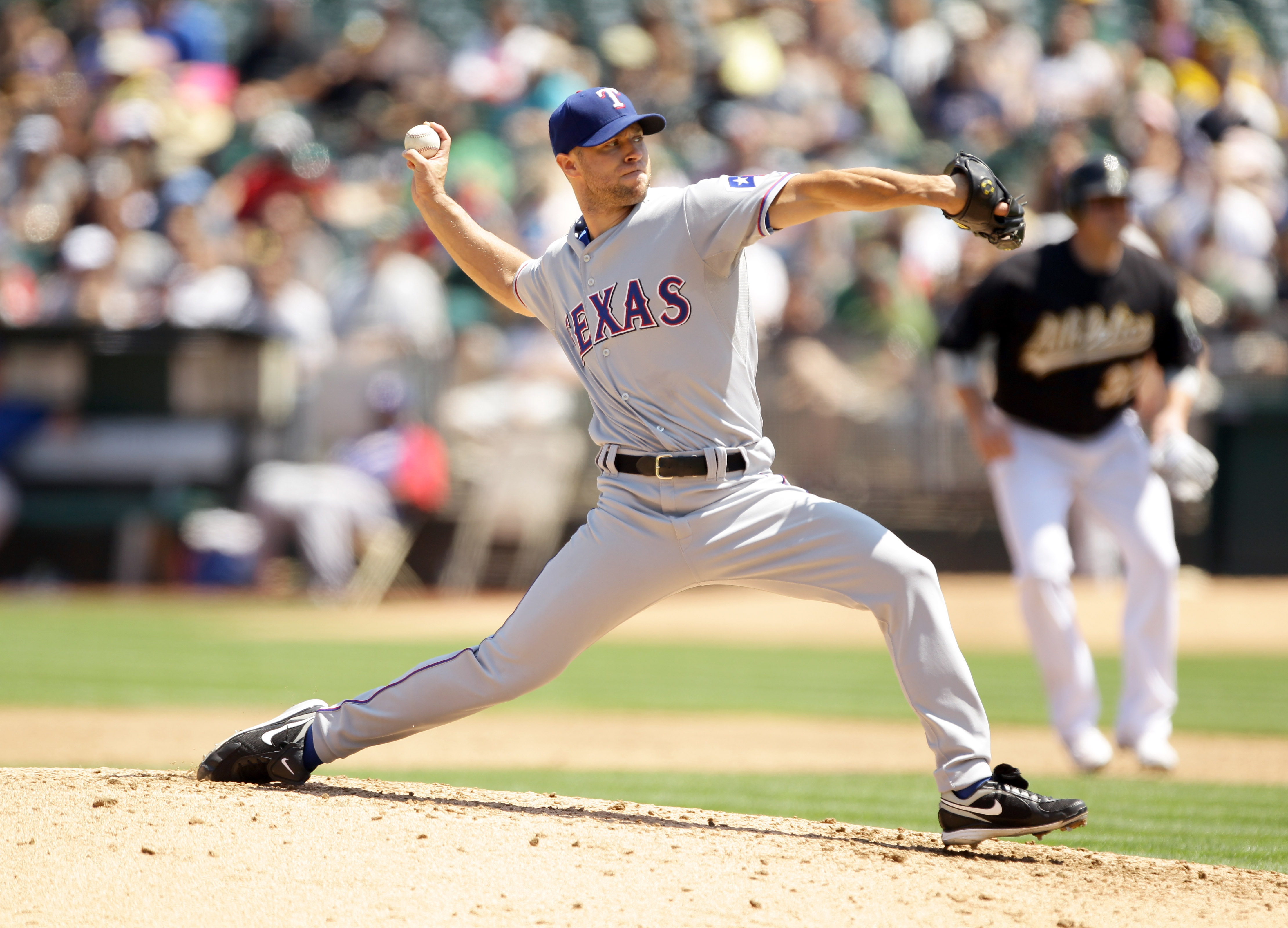 Texas Rangers pitcher Vicente Padilla wipes his face with his