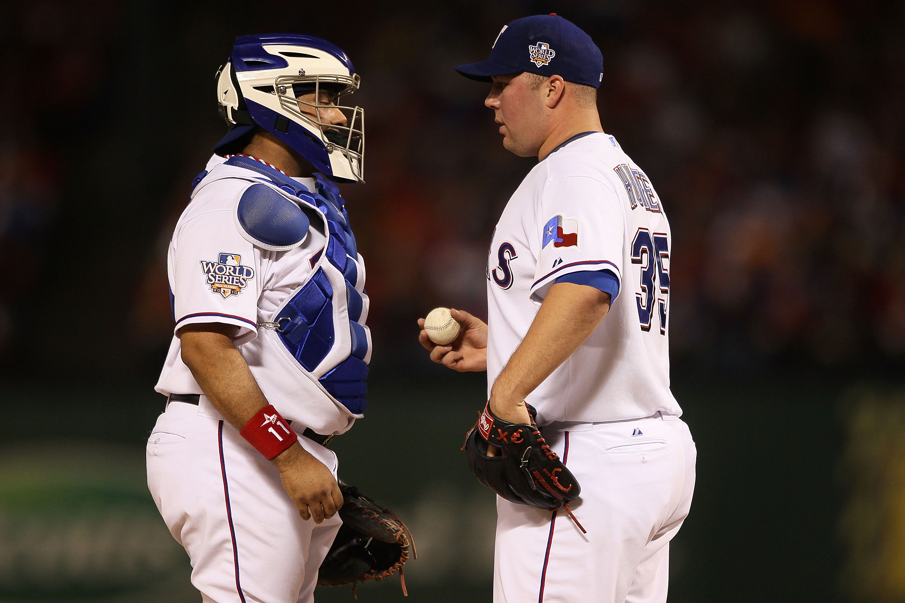 ARLINGTON, TX - OCTOBER 31:  (L-R) Bengie Molina #11 of the Texas Rangers talks with starting pitcher Tommy Hunter #35 against the San Francisco Giants in Game Four of the 2010 MLB World Series at Rangers Ballpark in Arlington on October 31, 2010 in Arlin