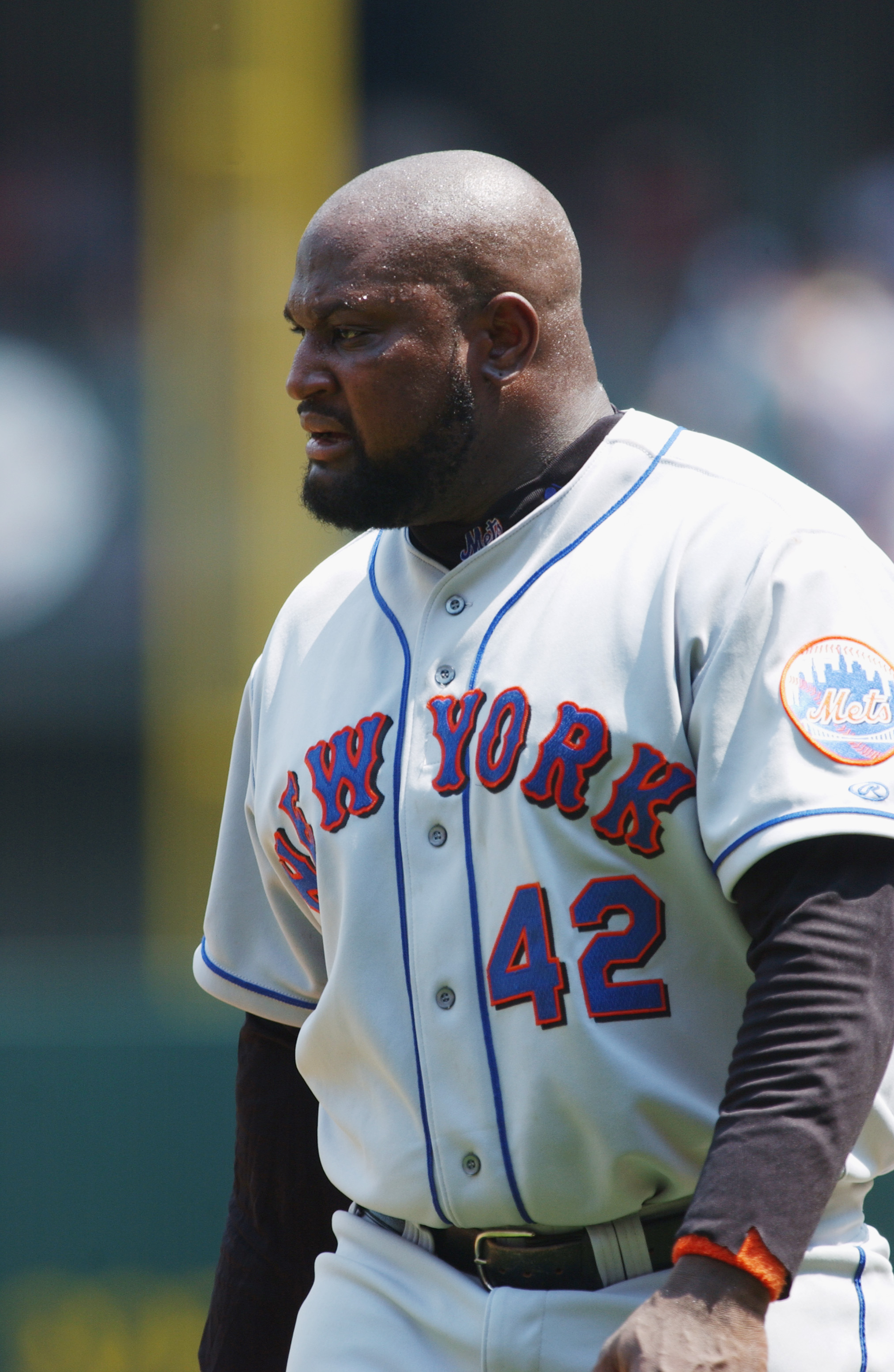 CINCINNATI - JULY 21:  First baseman Mo Vaughn #42 of the New York Mets walks on the field between innings during the MLB game against the Cincinnati Reds on July 21, 2002  at Cinergy Field in Cincinnati, Ohio.  The Reds defeated the Mets 9-1. (Photo By M