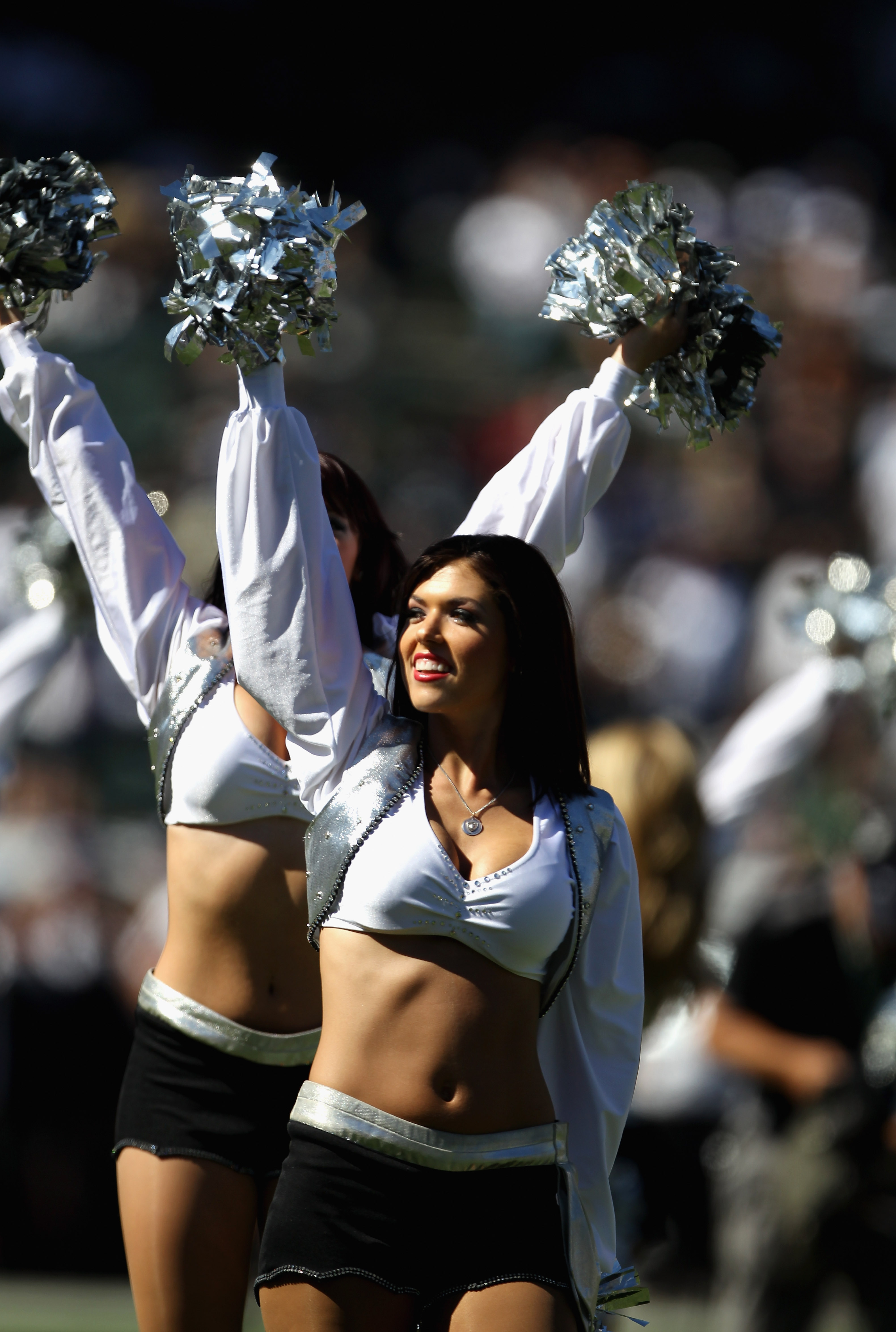 OAKLAND, CA - OCTOBER 10:  Oakland Raiders cheerleaders, the Raiderettes, cheer for their team during their game against the San Diego Chargers at Oakland-Alameda County Coliseum on October 10, 2010 in Oakland, California.  (Photo by Ezra Shaw/Getty Image