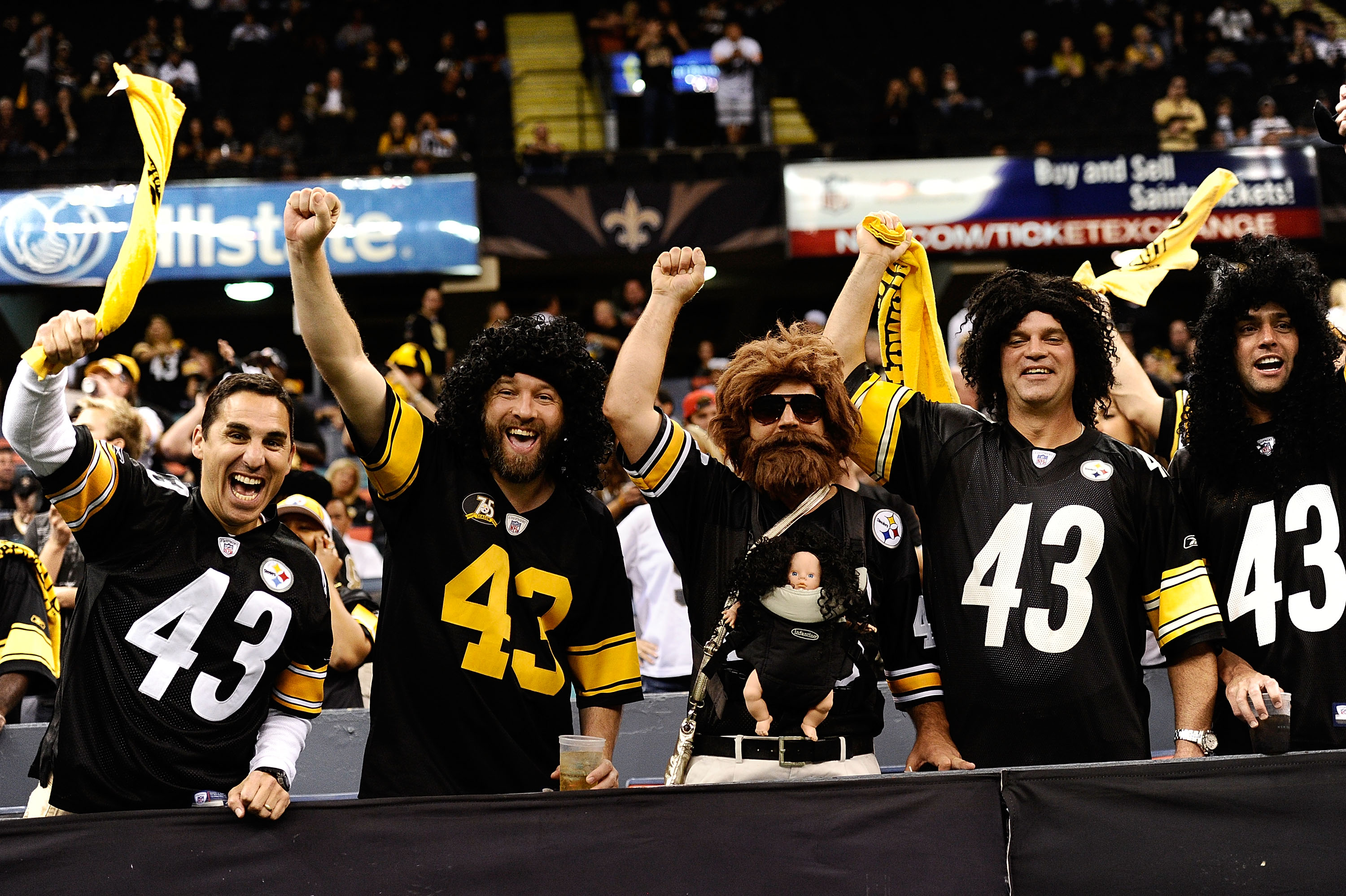 NEW ORLEANS - OCTOBER 31:  Fans dressed as Troy Polamalu #43 of the Pittsburgh Steelers pump their fist during the game against the New Orleans Saints at Louisiana Superdome on October 31, 2010 in New Orleans, Louisiana.  The Saints won 20-10 over the Ste