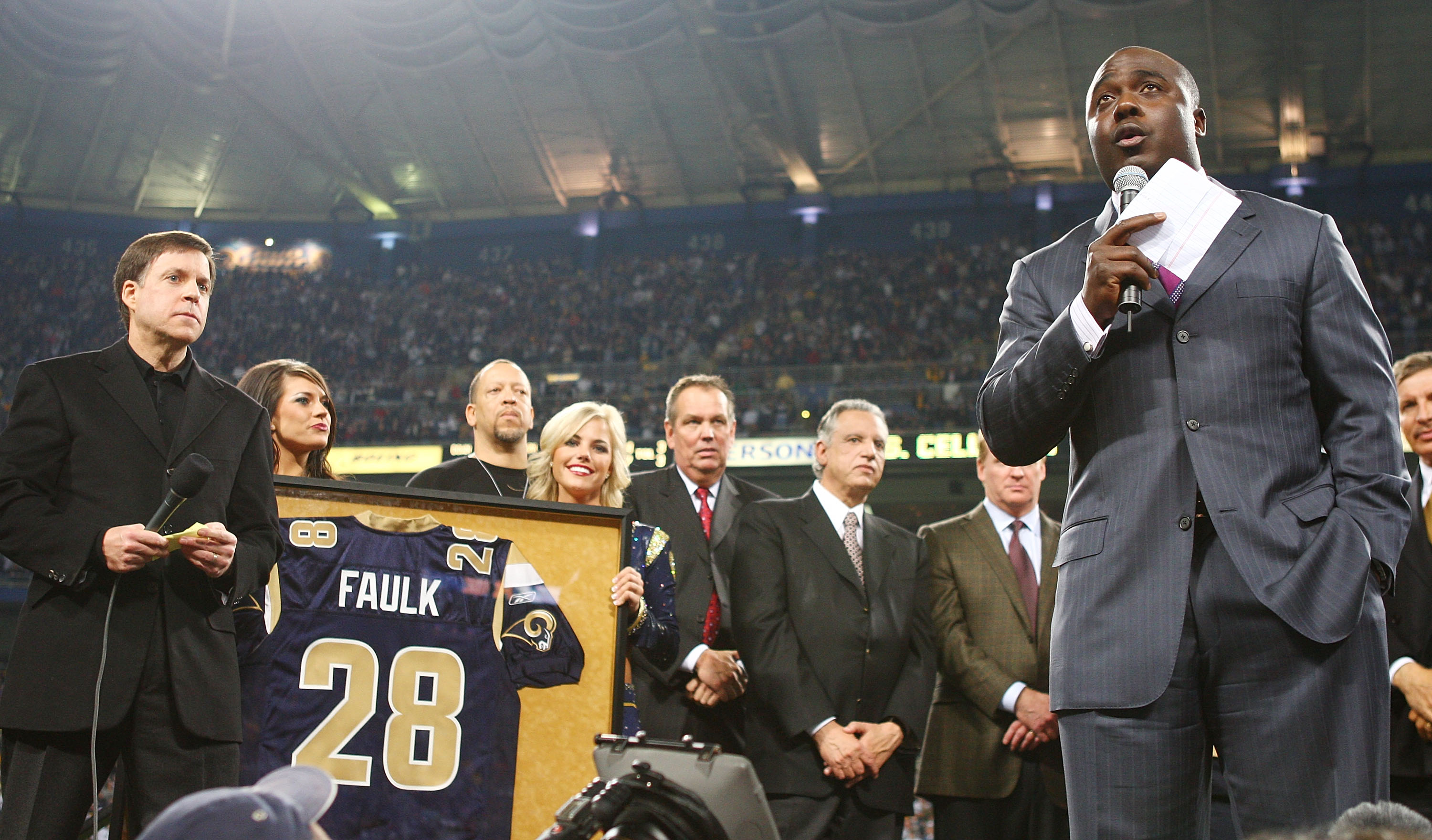 ST. LOUIS - DECEMBER 20: Former running back Marshall Faulk of the St. Louis Rams addresses the fans during a halftime ceremony to retire his jersey on December 20, 2007 at Edward Jones Dome in St. Louis, Missouri. (Photo by Elsa/Getty Images)